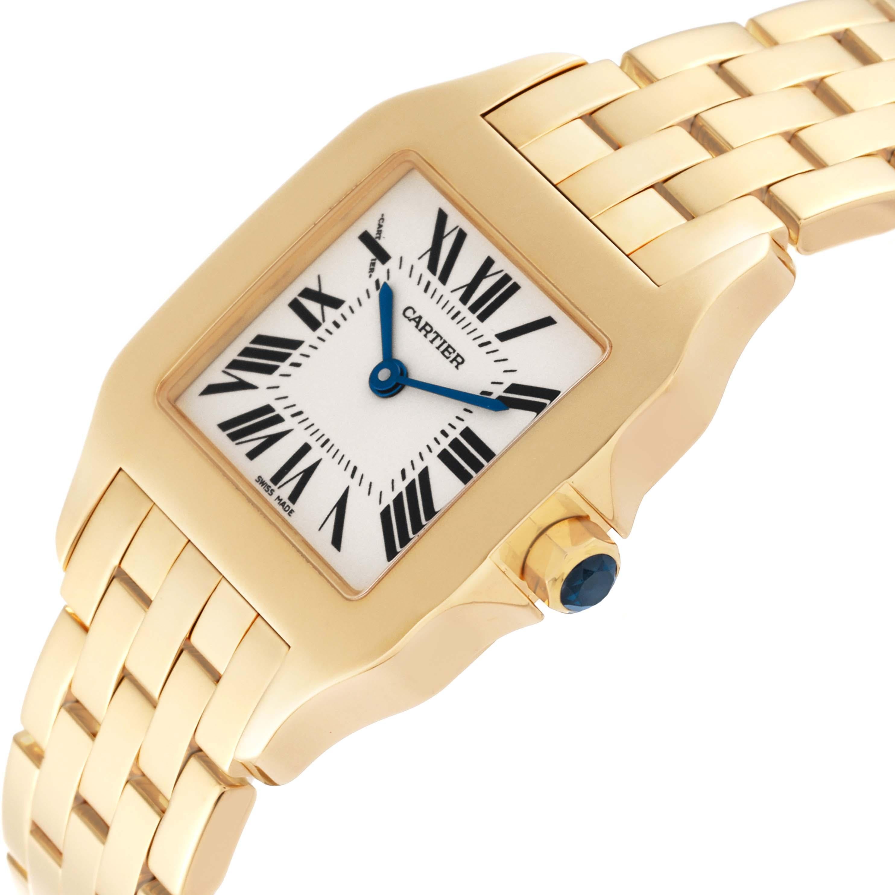Cartier Santos Demoiselle Midsize Yellow Gold Ladies Watch W25062X9. Quartz movement. 18k yellow gold case 36.5 x 26.0 mm. Octagonal crown set with the blue faceted sapphire. . Scratch resistant sapphire crystal. Silvered grained dial with black