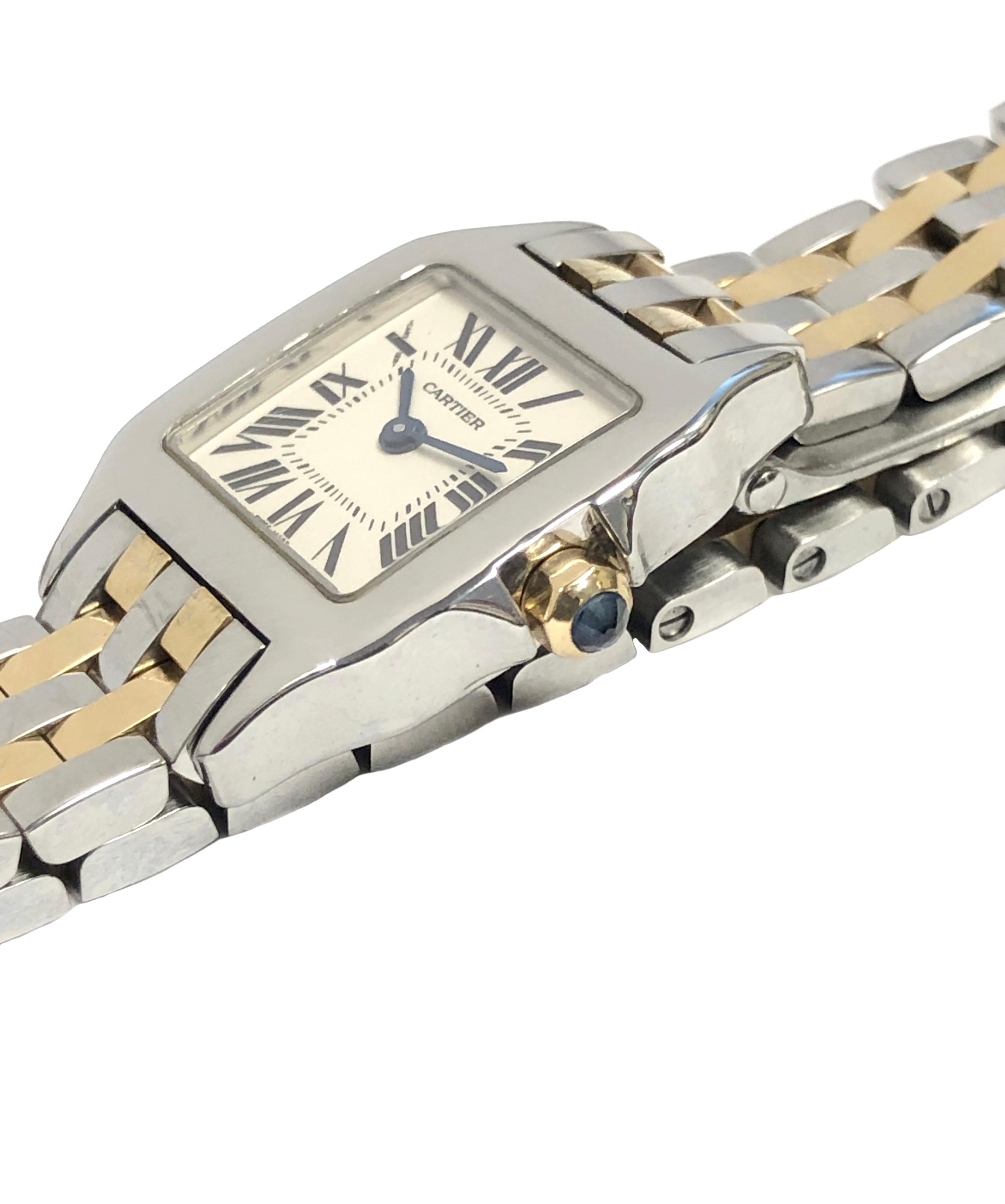 Circa 2017 - 2020 Cartier Santos Demoiselle collection Ladies Wrist Watch, 27 X 20 M.M. Stainless Steel 2 piece water resistant case with Sapphire set Gold crown. Quartz movement, White dial with Black Roman numerals. Stainless Steel and 18K Yellow