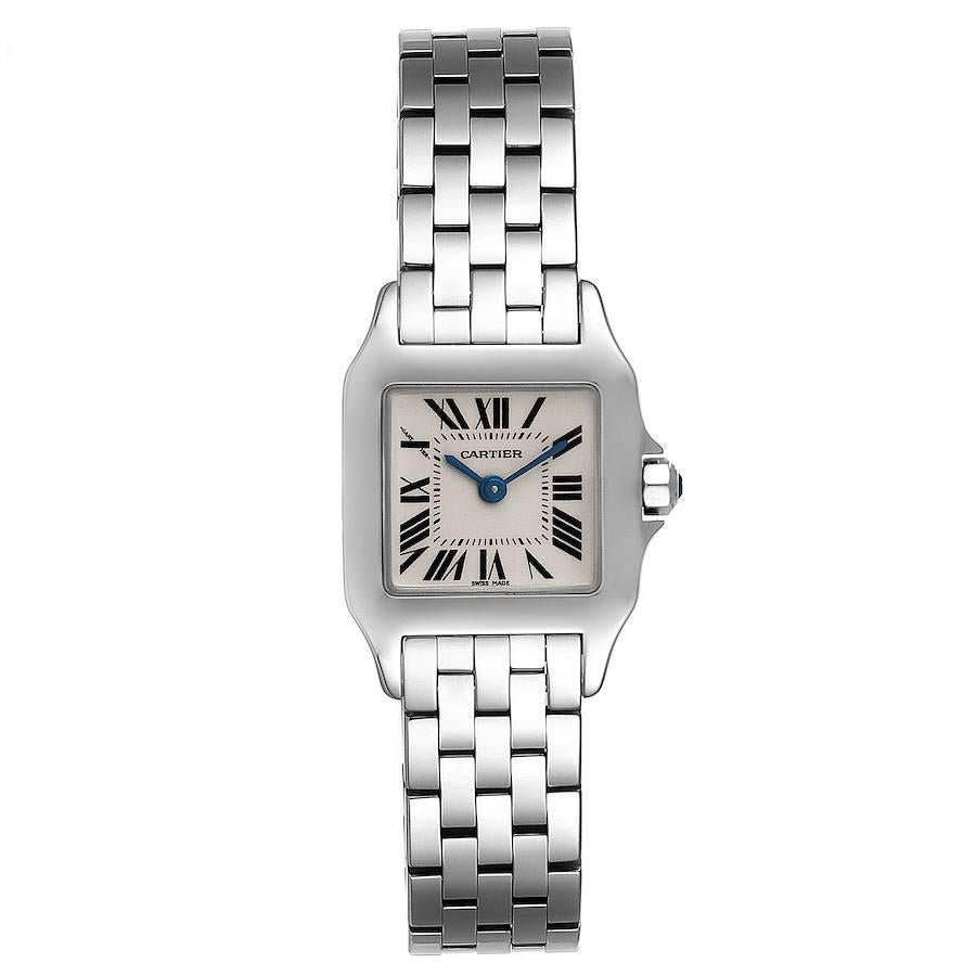 Cartier Santos Demoiselle Steel Silver Dial Ladies Watch W25064Z5. Quartz movement. Stainless steel case 20.0 x 20.0 mm. Octagonal crown set with the blue faceted spinel. . Scratch resistant sapphire crystal. Silvered grained dial. Painted black