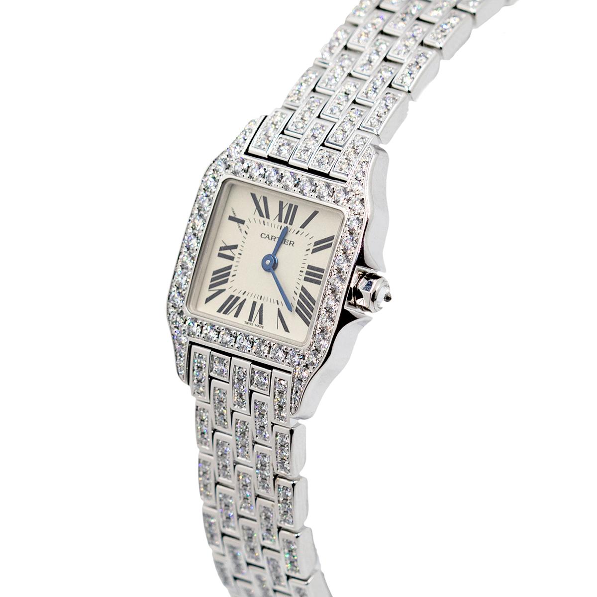 Pre-owned Cartier Santos Demoiselle (ref. WF9010YA), featuring a quartz movement; silvered dial with black roman numerals & blued-steel sword-shaped hands; and 21 x 30mm, 18k white gold case, the bezel & lugs set with a row of brilliant-cut