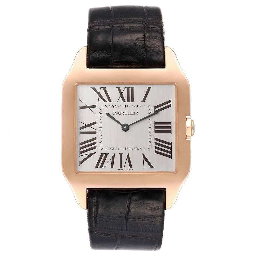 Cartier Santos Dumont 18k Rose Gold Mens Watch W2006951 Box Papers. Manual winding movement. 18k rose gold case 44.6 x 34.6 mm. Circular grained crown set with faceted sapphire. . Scratch resistant sapphire crystal. Silver dial. Painted black roman