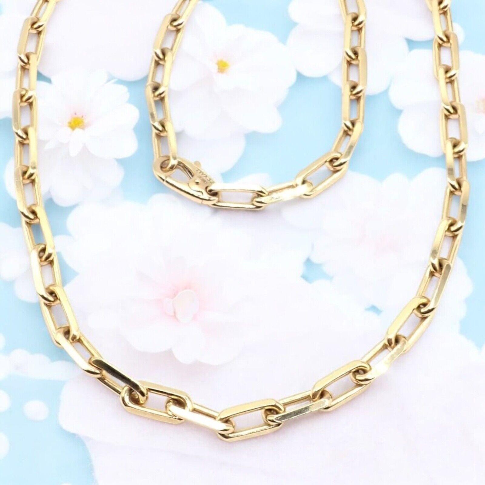 18k Yellow Gold Santos-Dumont Link Chain Necklace by Cartier. 
Elevate your style with the iconic Cartier Santos 18k Yellow Gold Link Chain Necklace, measuring 22