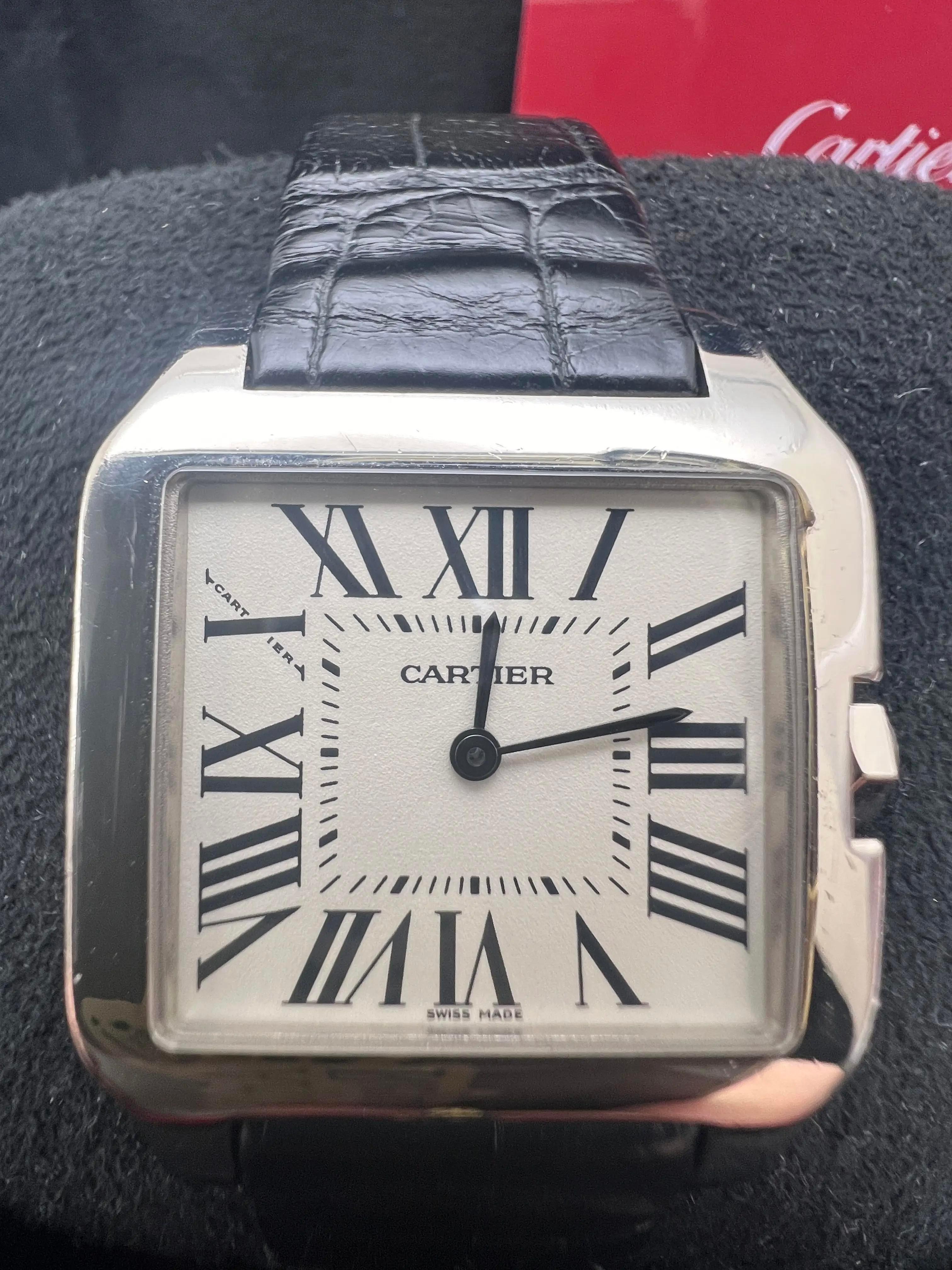 ​The 2022 Cartier Santos Dumont (reference W2009451) is a refined timepiece that embodies Cartier's commitment to blending classic design with modern elegance. Crafted from 18K white gold, the 30.5mm x 38.5mm case features a satin-finished surface,