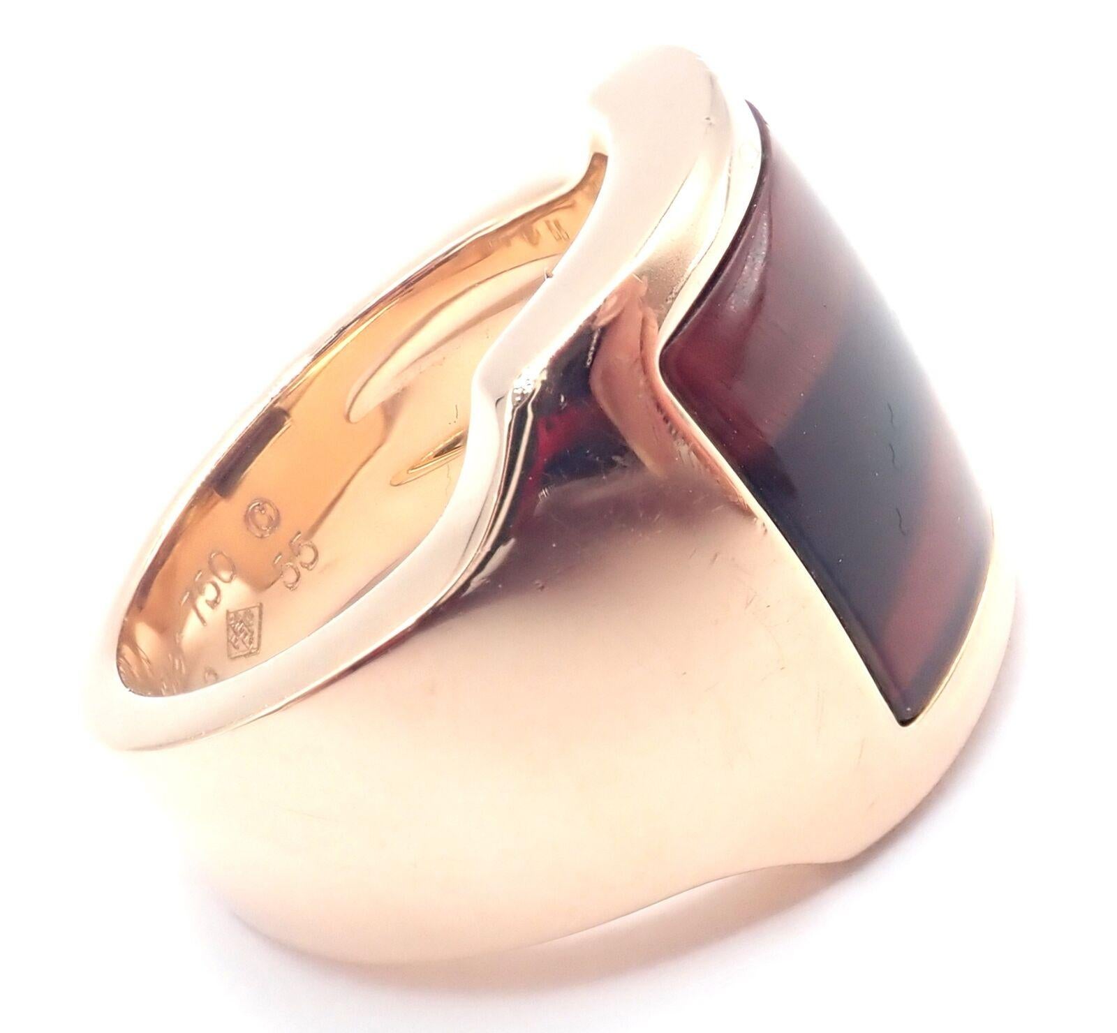 18k Rose Gold Bull's Eye Quartz Santos Dumont Ring by Cartier.  
With 1 Bull's Eye Quartz
The Cartier Santos Dumont Bull Eye ring is a striking piece of jewelry, crafted from luxurious 18k rose gold. 
Featuring a distinctive bull's eye quartz