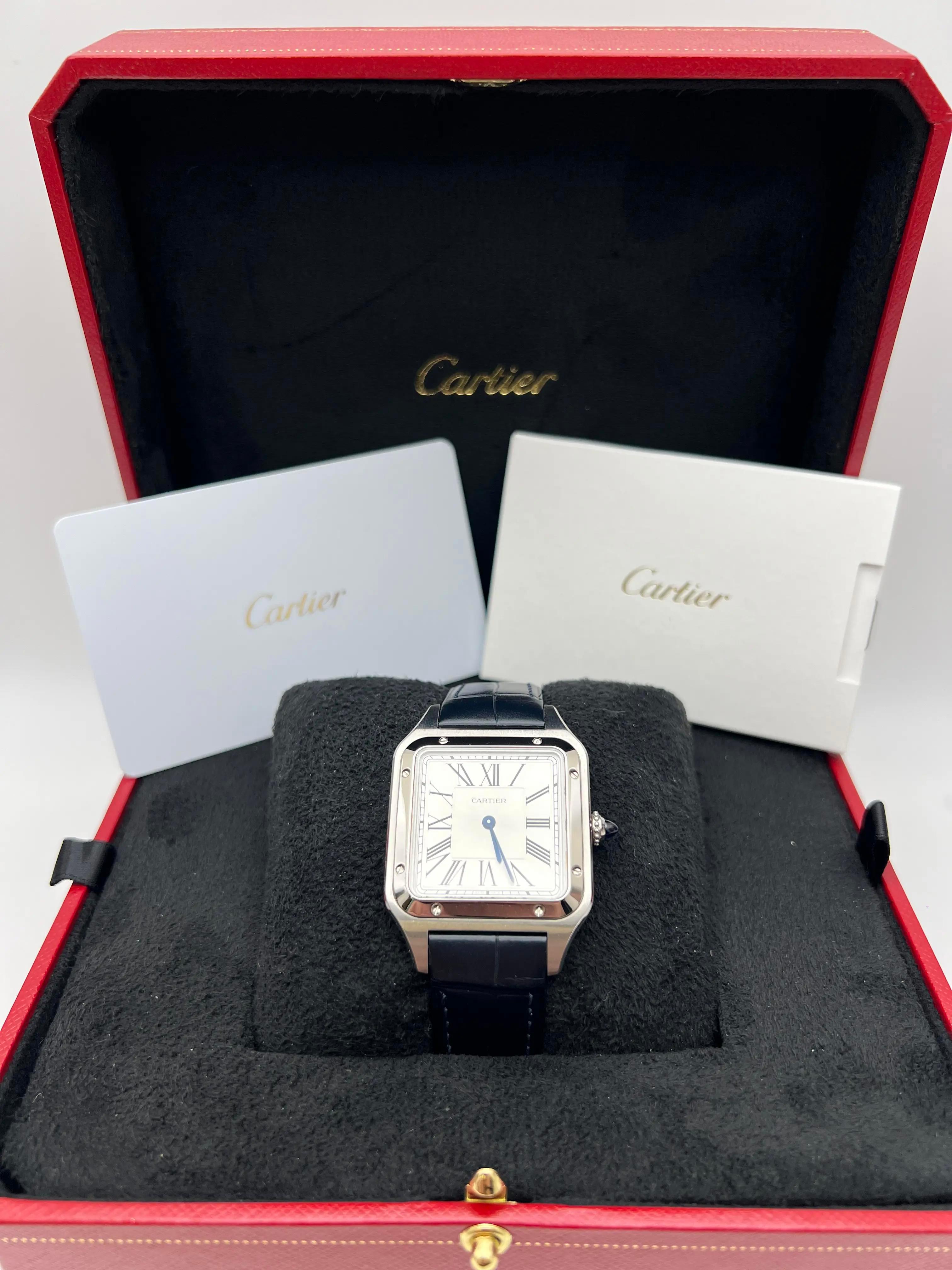 The Cartier Santos Dumont Large (ref. WSSA0022) embodies timeless Cartier elegance in a sleek and modern execution. Measuring 43.5mm x 31.4mm with a slim 7.3mm profile, the polished stainless steel case showcases clean lines and the iconic Santos