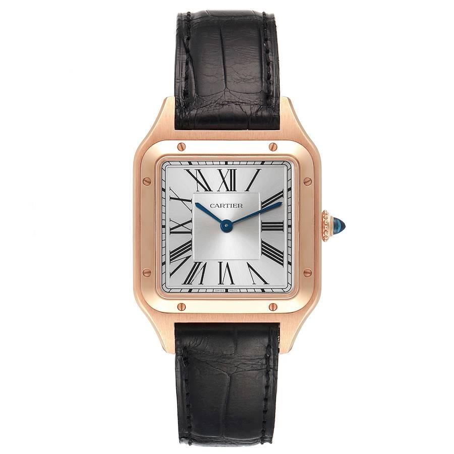 Cartier Santos Dumont Large Rose Gold Silver Dial Mens Watch WGSA0021. Quartz movement. 18k rose gold case 43.5 mm x 31.4 mm. Case thickness 7.3 mm. Circular grained crown set with blue spinel cabochon. 18k rose gold bezel punctuated with 8