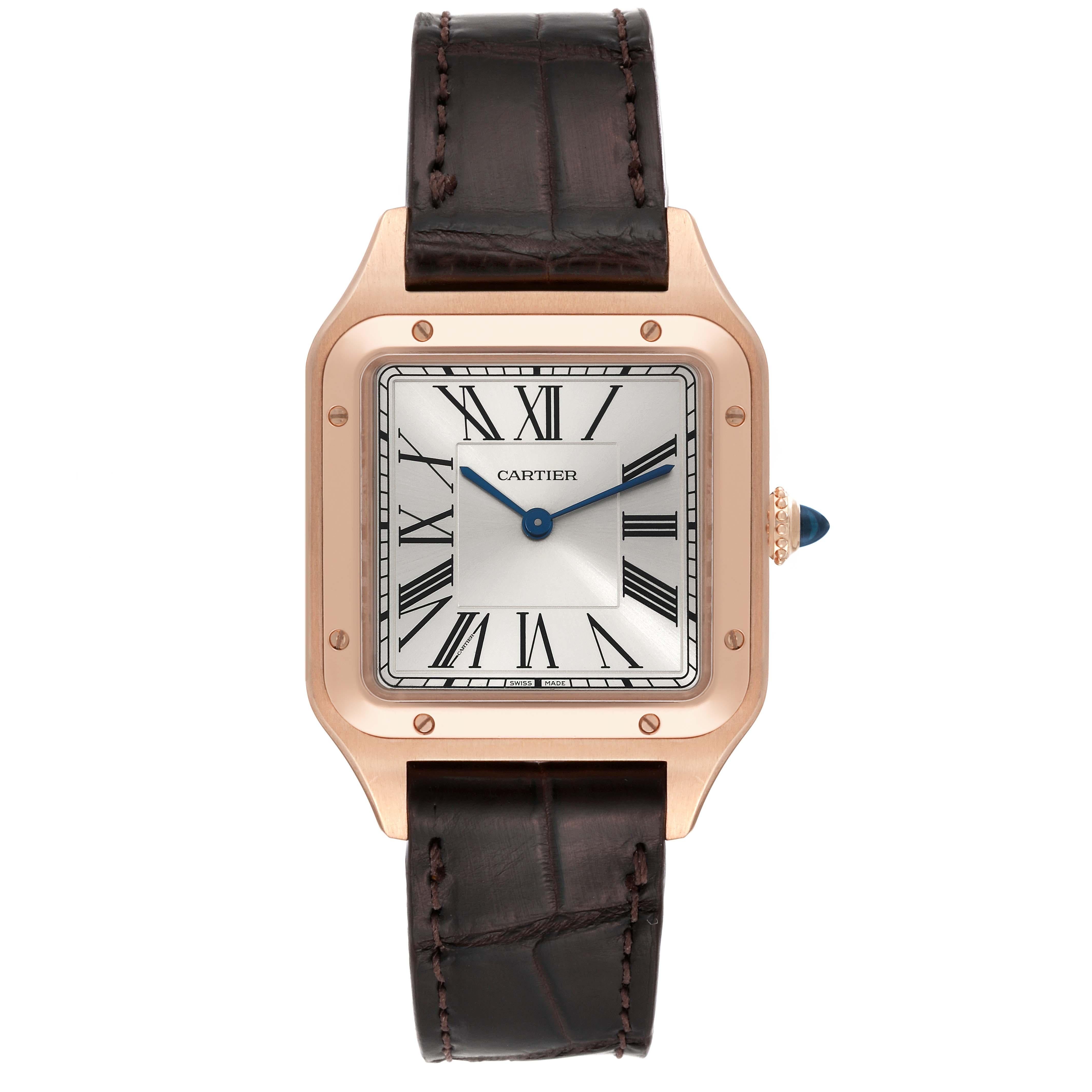 Cartier Santos Dumont Large Rose Gold Silver Dial Mens Watch WGSA0021. Quartz movement. 18k rose gold case 43.5 mm x 31.4 mm. Case thickness 7.3 mm. Circular grained crown set with blue spinel cabochon. 18k rose gold bezel punctuated with 8