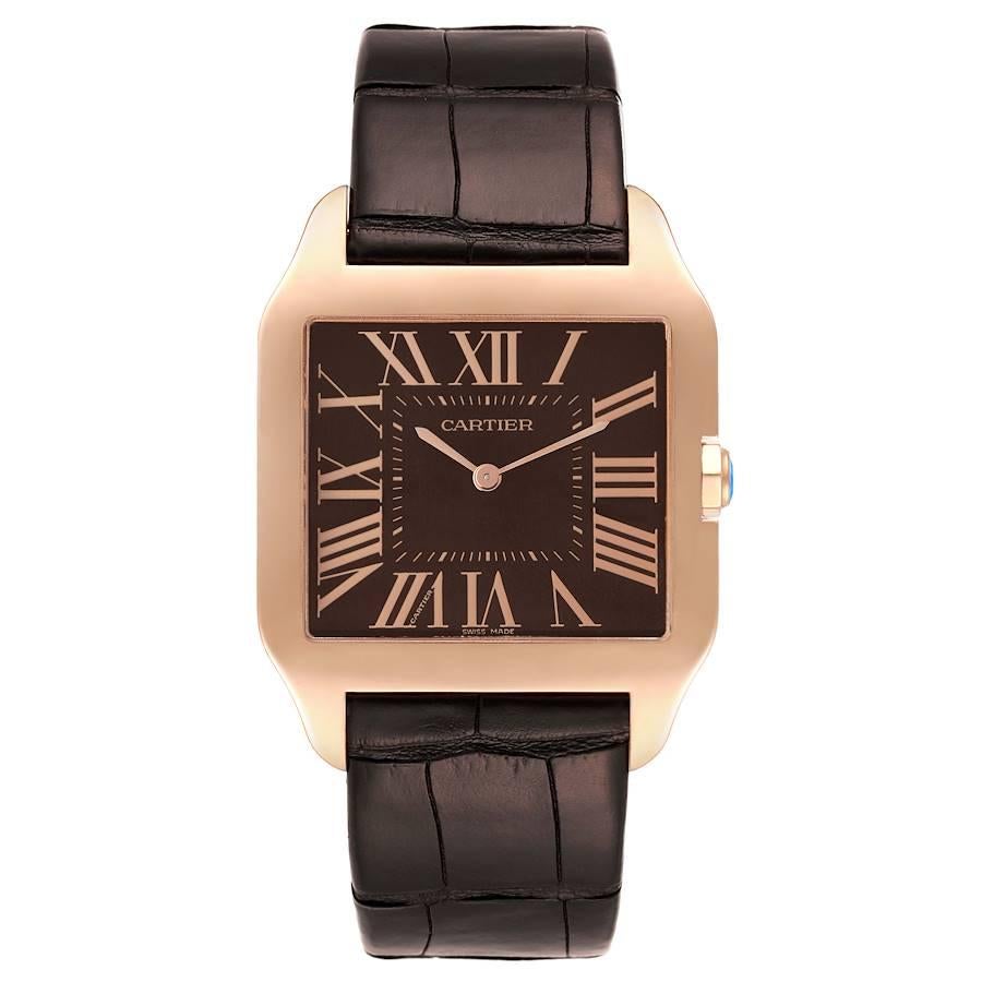 Cartier Santos Dumont Mens 18k Rose Gold Mens Watch W2012851. Manual winding movement. 18k rose gold case 44.6 x 34.6 mm. Circular grained crown set with faceted sapphire. . Scratch resistant sapphire crystal. Chocolate brown dial with rose gold