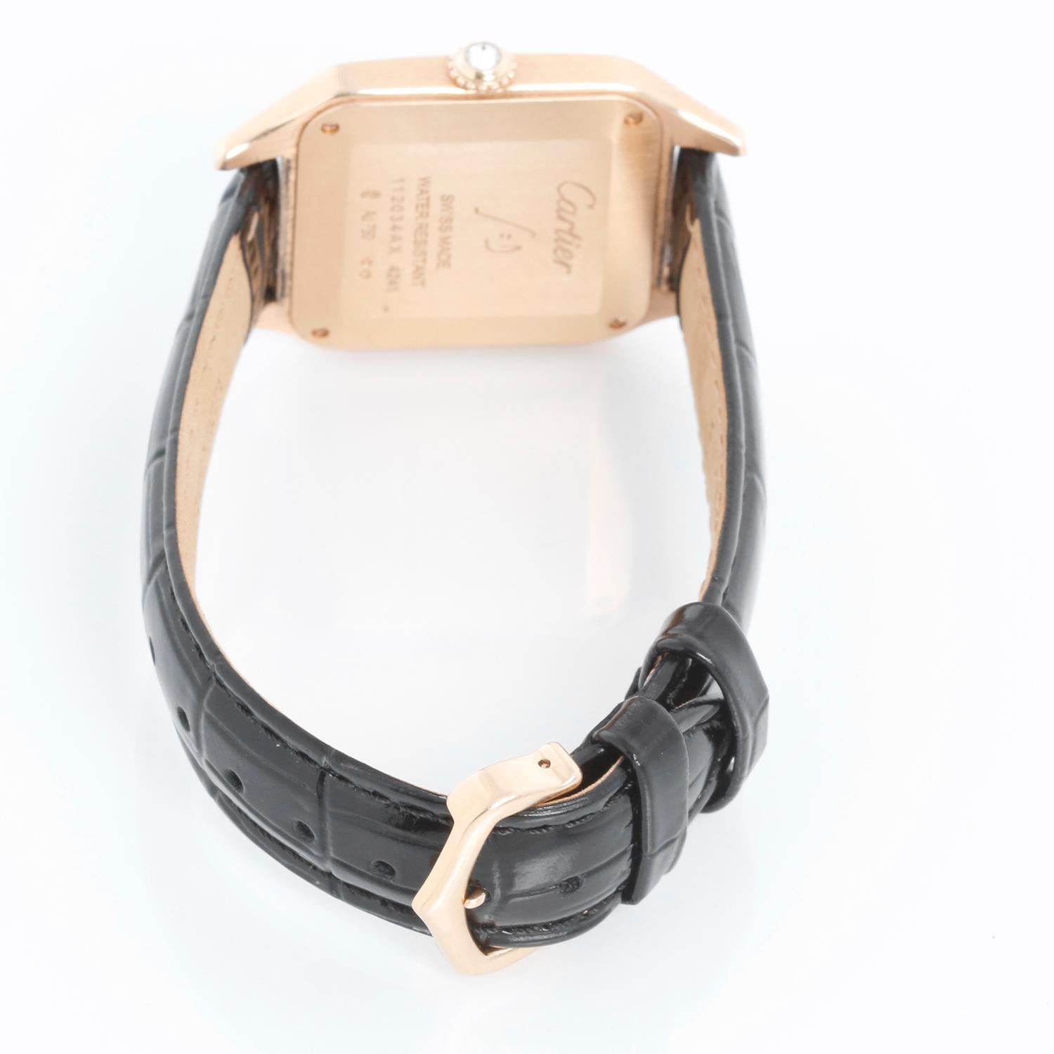 Cartier Santos Dumont Quartz 18k Rose  Gold  WJSA0016 4241 - Quartz. 18k rose gold square case; diamond bezel (31 mm x 42 mm) diameter. Silver Dial with Roman numerals. Black strap with 18k rose gold Cartier buckle. Pre-owned with Cartier box.