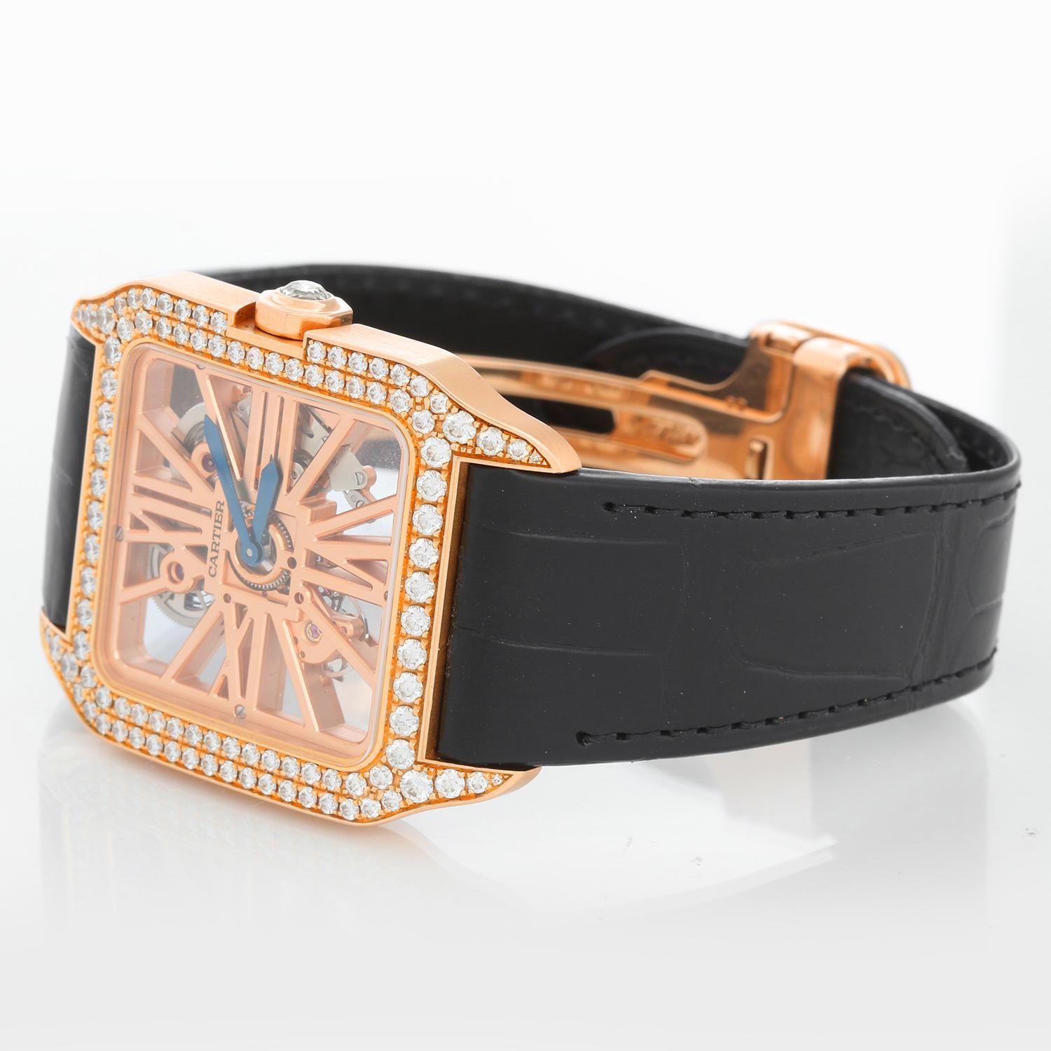 Cartier Santos Dumont Skeleton Rose Gold Diamond Watch HPI00587  - Manual. 18K Rose Gold with Diamond bezel and diamond crown( 38 mm x 47 mm ). Skeleton complication of bridges in the form of Roman numerals. New Cartier black strap with rose gold