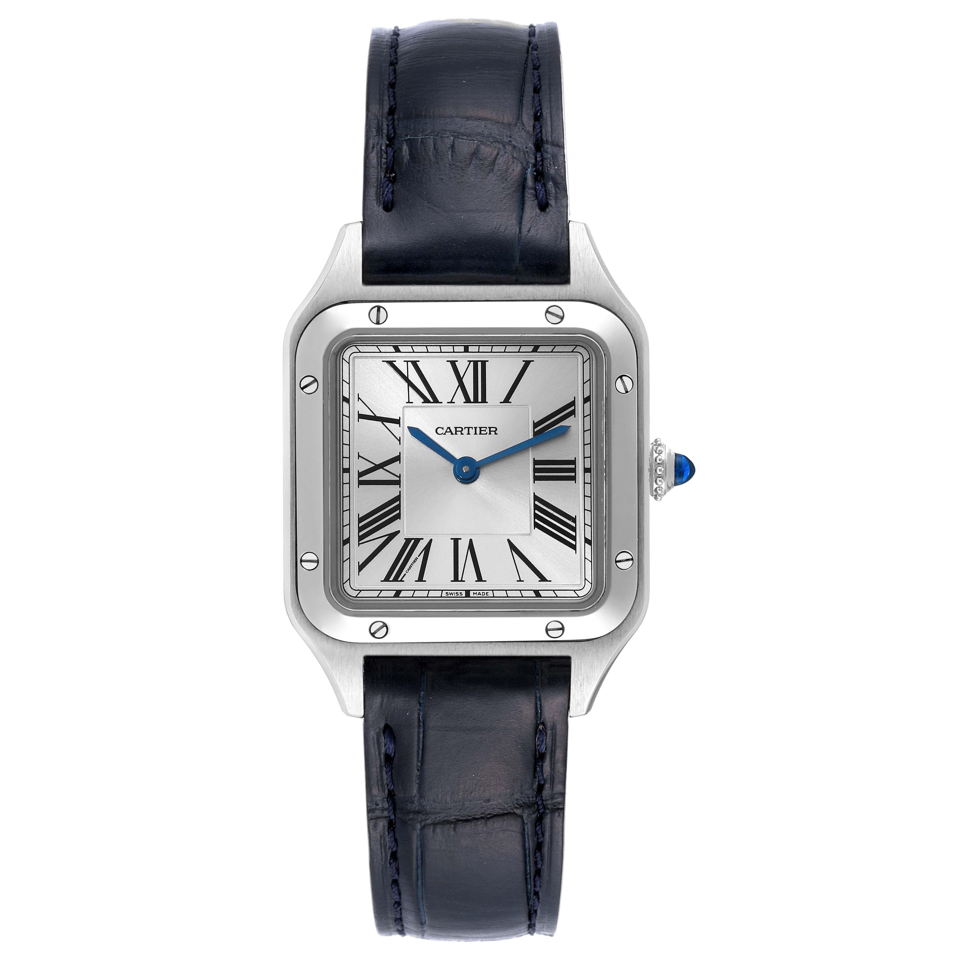 Cartier Santos Dumont Small Steel Ladies Watch WSSA0023 Box Card. Quartz movement. Stainless steel case 38 mm x 27.5 mm. Case thickness 7.3 mm. Circular grained crown set with blue spinel cabochon. Stainless steel bezel punctuated with 8 signature