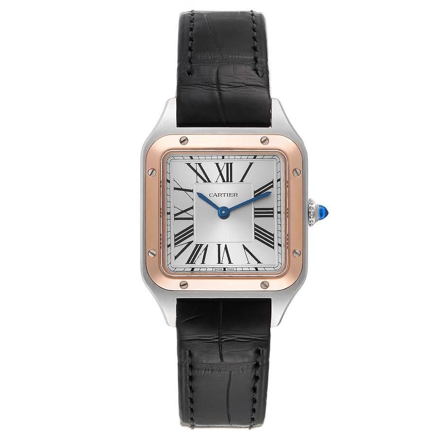 Cartier Santos Dumont Steel Rose Gold Ladies Watch W2SA0012 Unworn. Quartz movement. Stainless steel case 38 mm x 27.5 mm. Case thickness 7.3 mm. Circular grained crown set with blue spinel cabochon. 18k rose gold bezel punctuated with 8 signature