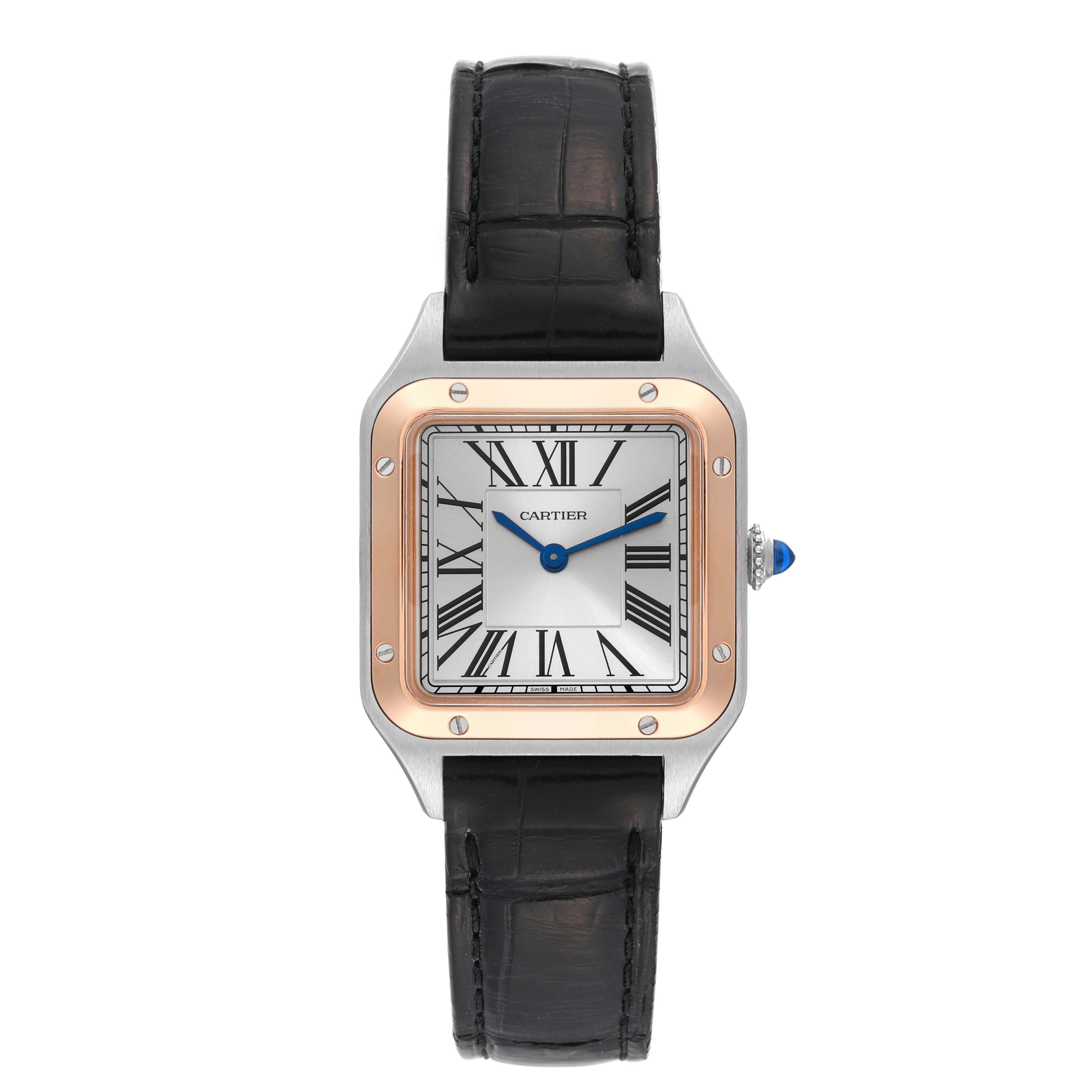 Cartier Santos Dumont Steel Rose Gold Silver Dial Ladies Watch W2SA0012. Quartz movement. Stainless steel case 38 mm x 27.5 mm. Case thickness 7.3 mm. Circular grained crown set with blue spinel cabochon. 18k rose gold bezel punctuated with 8