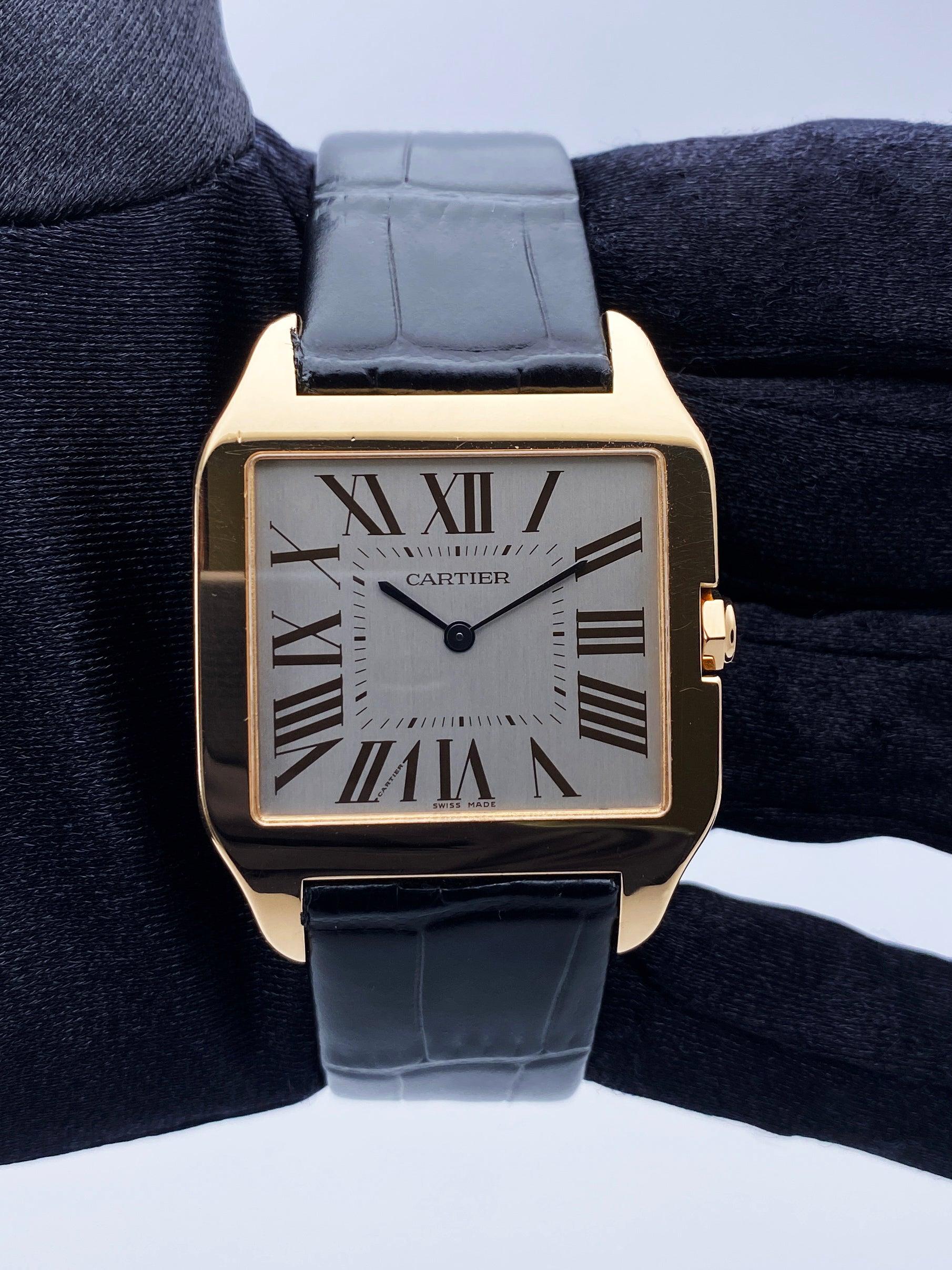 Cartier Santos Dumont W2006951 Ladies Watch. 35mm 18K rose gold case. Grey satin-brushed dial with black hands and black Roman numeral hour marker. Minute markers on the inner dial. black leather strap with 18K rose gold deployant clasp. Will fit up