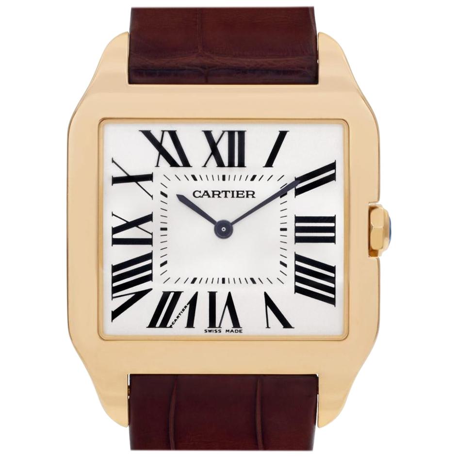 Cartier Santos Dumont Reference #: W2008751. Mens Mechanical Hand Wind Watch Yellow Gold Beige 29 MM. Verified and Certified by WatchFacts. 1 year warranty offered by WatchFacts.
