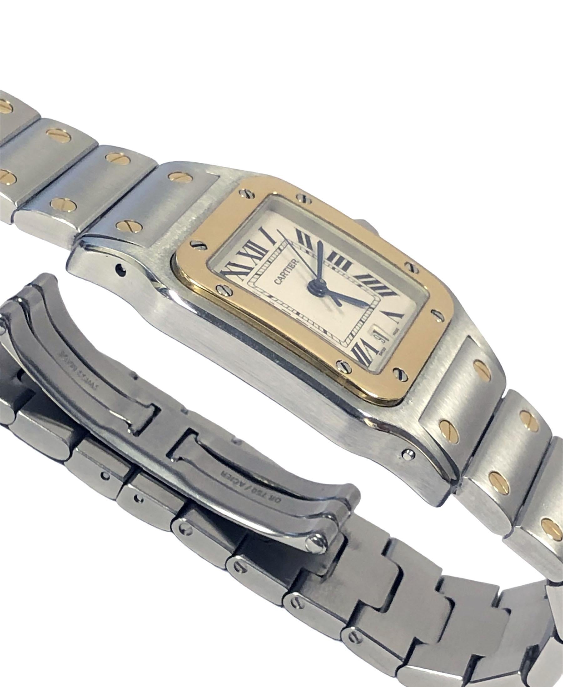 Circa 2012 Cartier Santos Galbee 1566 Wrist Watch 29 X 29 M.M Stainless Steel case with 18K Yellow Gold Bezel and a Sapphire Crown, Quartz Movement, White Dial with Black Roman Numerals a Calendar window at the 6 position and a sweep seconds Hand. 