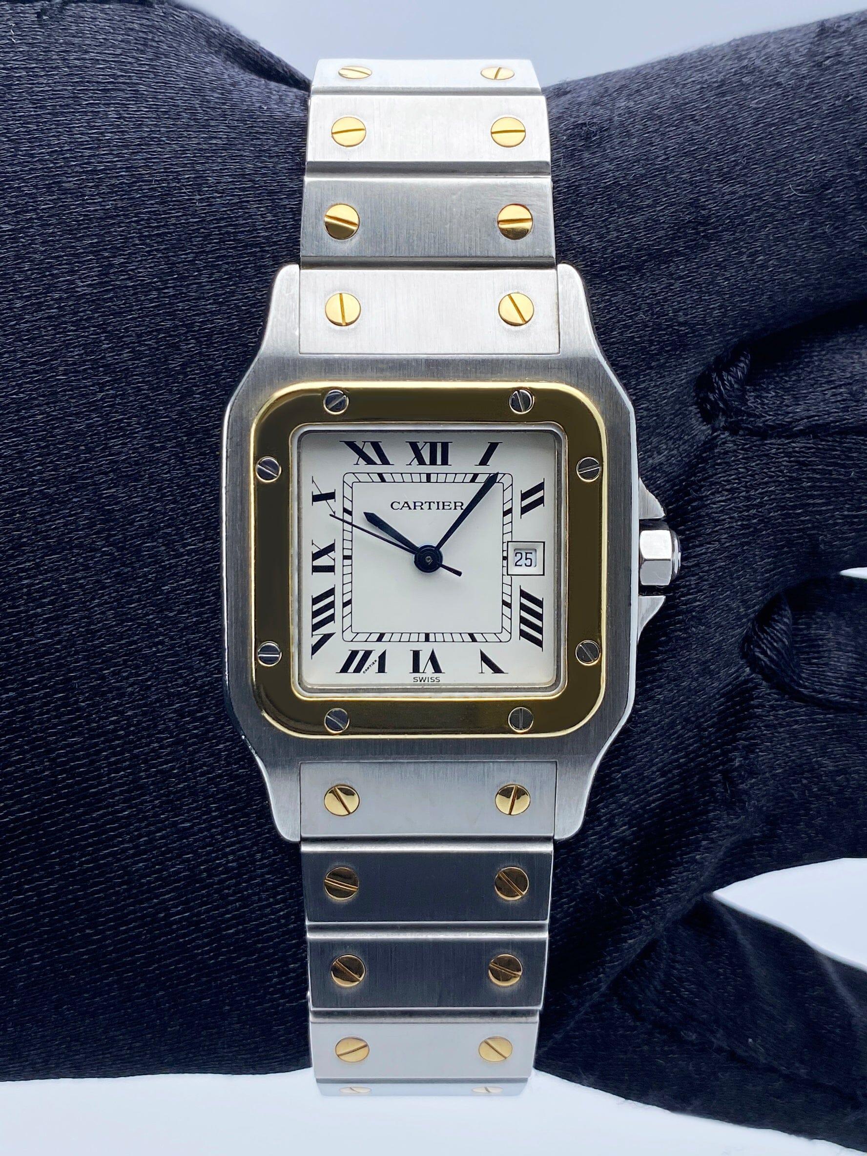 Cartier Santos Galbee¬†2961 Watch. 29mm stainless steel case. 18K yellow gold fixed bezel.¬†Off-White dial with blue hands and Roman numeral hour marker. 18K yellow gold &¬†stainless steel bracelet with hidden butterfly¬†clasp. Will fit up to a