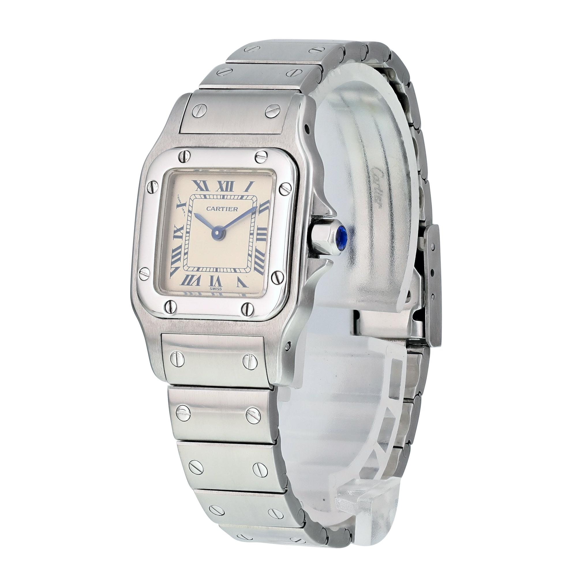 Cartier Santos Galbee 9057930 Ladies Watch.
24mm Stainless Steel case. 
Stainless Steel Stationary bezel. 
White dial with blue steel hands and index hour markers. 
Minute markers on the outer dial. 
Stainless Steel Stainless Steel with Fold Over