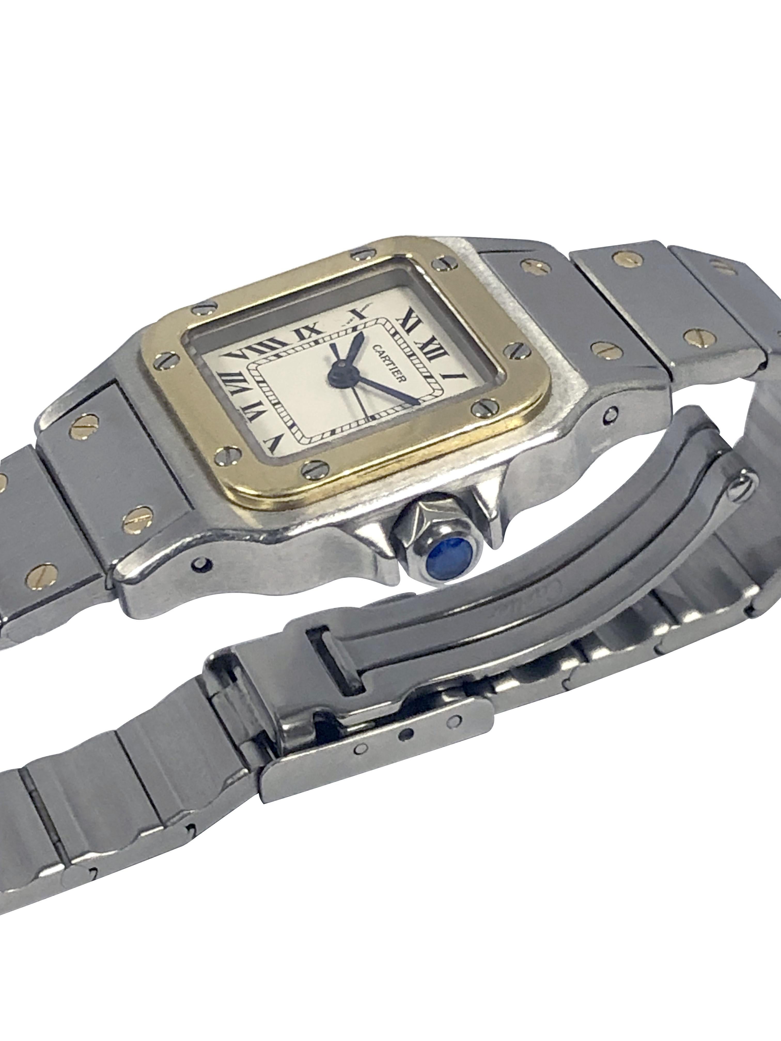 Circa 1990s Cartier Santos Galbee collection Ladies Wrist watch, 34 x 24 M.M Stainless Steel 3 piece case with 18k Yellow Gold bezel, Sapphire set crown, Sapphire Glass Crystal, Automatic, self winding movement, White dial with Black Roman numerals