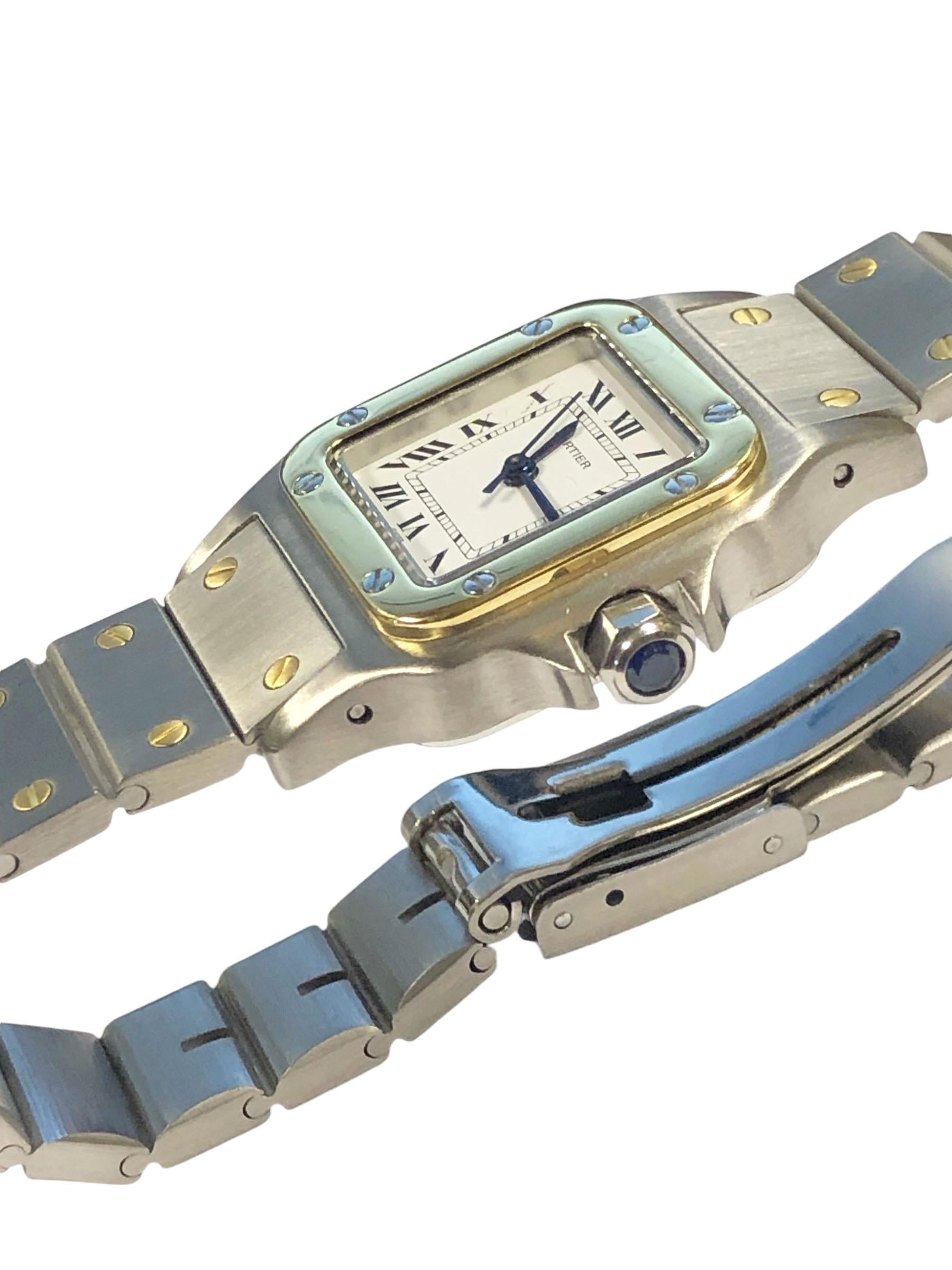 Circa 2000 Cartier Santos Galbee collection Ladies Wrist watch, 34 x 24 M.M Stainless Steel 3 piece case with 18k Yellow Gold bezel, Sapphire set crown. Automatic, self winding movement, White dial with Black Roman numerals and a sweep seconds hand.