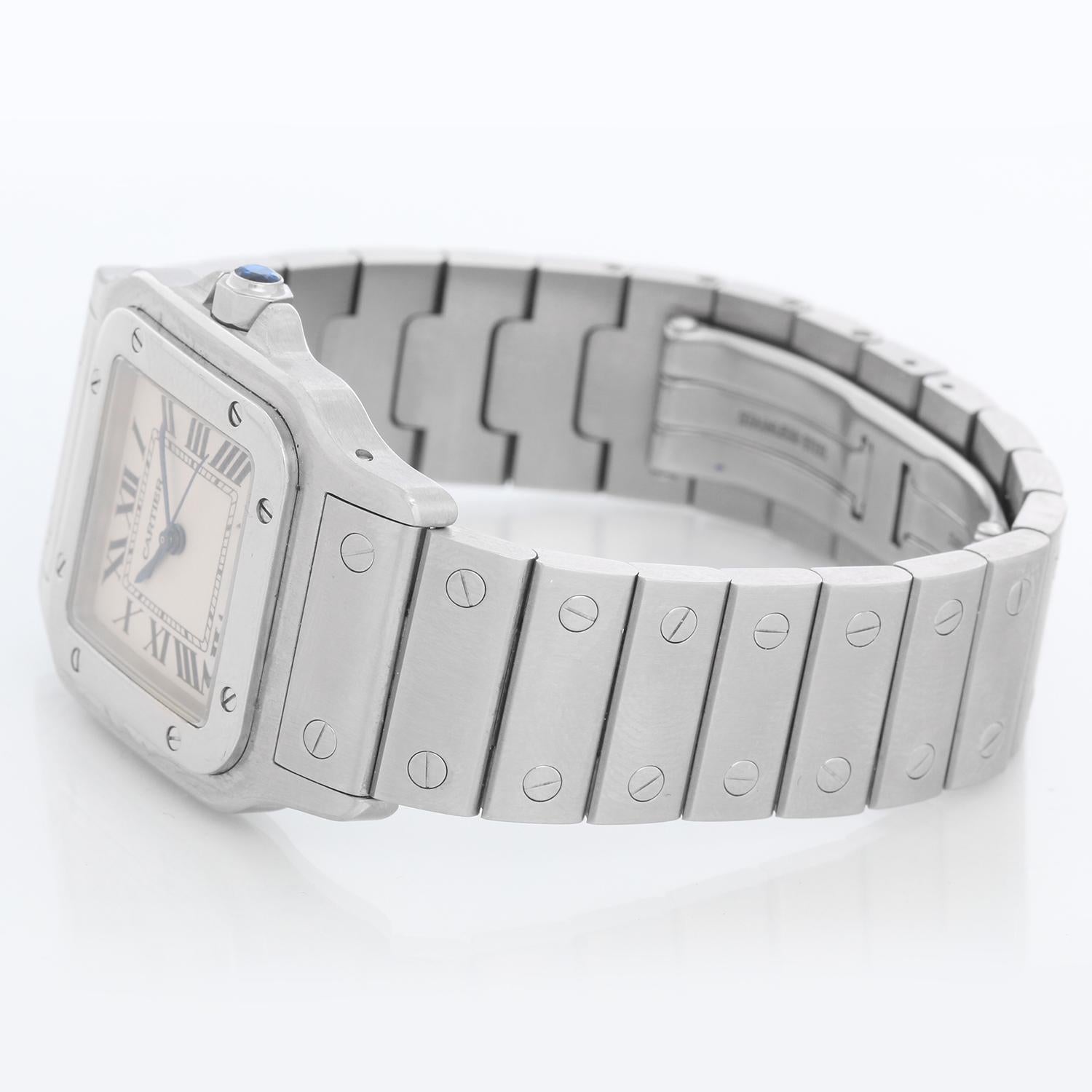 Cartier Santos Galbee Midsize Steel Quartz Watch W20060D6 1564 - Quartz. Stainless steel case (28mm x 40mm). Silver dial with blue Roman numerals; date at 6 o'clock. Stainless steel Santos bracelet; will fit up to a 7 inch wrist . Pre-owned with 