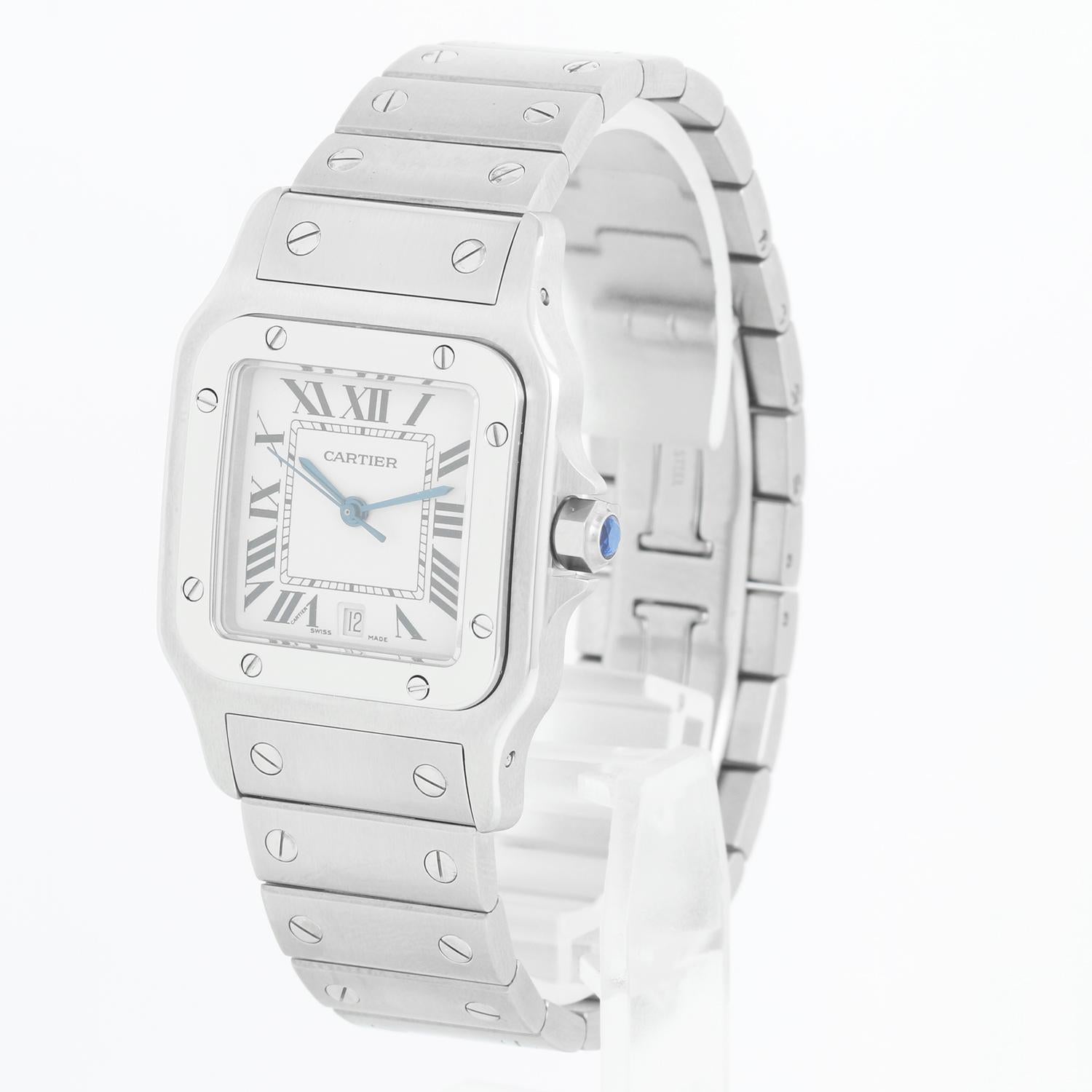 Cartier Santos Galbee Midsize Steel Quartz Watch W20060D6 1564 - Quartz. Stainless steel case (28mm x 40mm). Silver dial with blue Roman numerals; date at 6 o'clock. Stainless steel Santos bracelet; will fit up to a 61/2