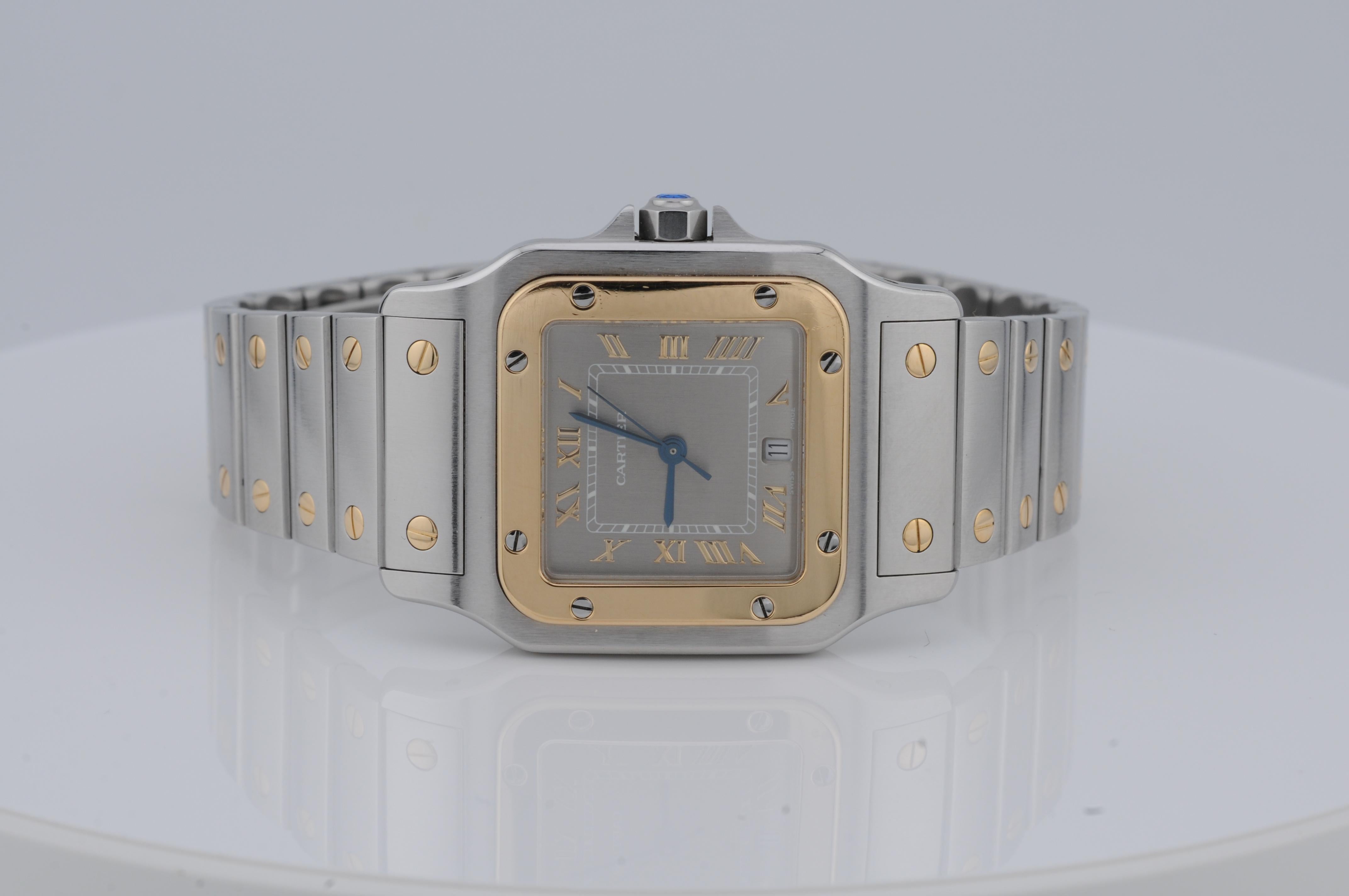 Cartier Santos Galbée Ref. 1566 – Steel & Gold Quartz Watch

This Cartier Santos Galbée Ref. 1566 features a 29x41mm stainless steel and gold case, housing a quartz movement. The elegant gray dial adds to its timeless appeal. The watch comes with