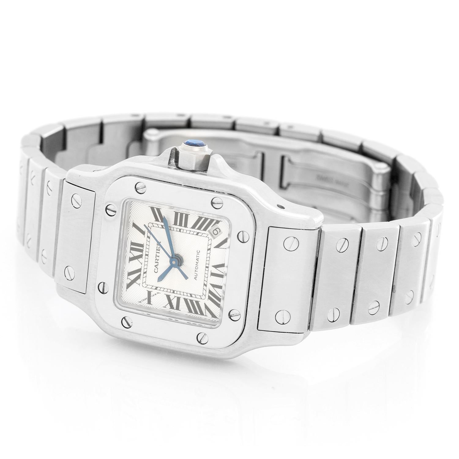 Cartier Santos Galbee Small Ladies Watch - Automatic. Stainless steel case (26mm x 26mm). Ivory dial with black Roman numerals; date at 5 o'clock. Stainless steel Santos bracelet. Pre-owned with custom box.