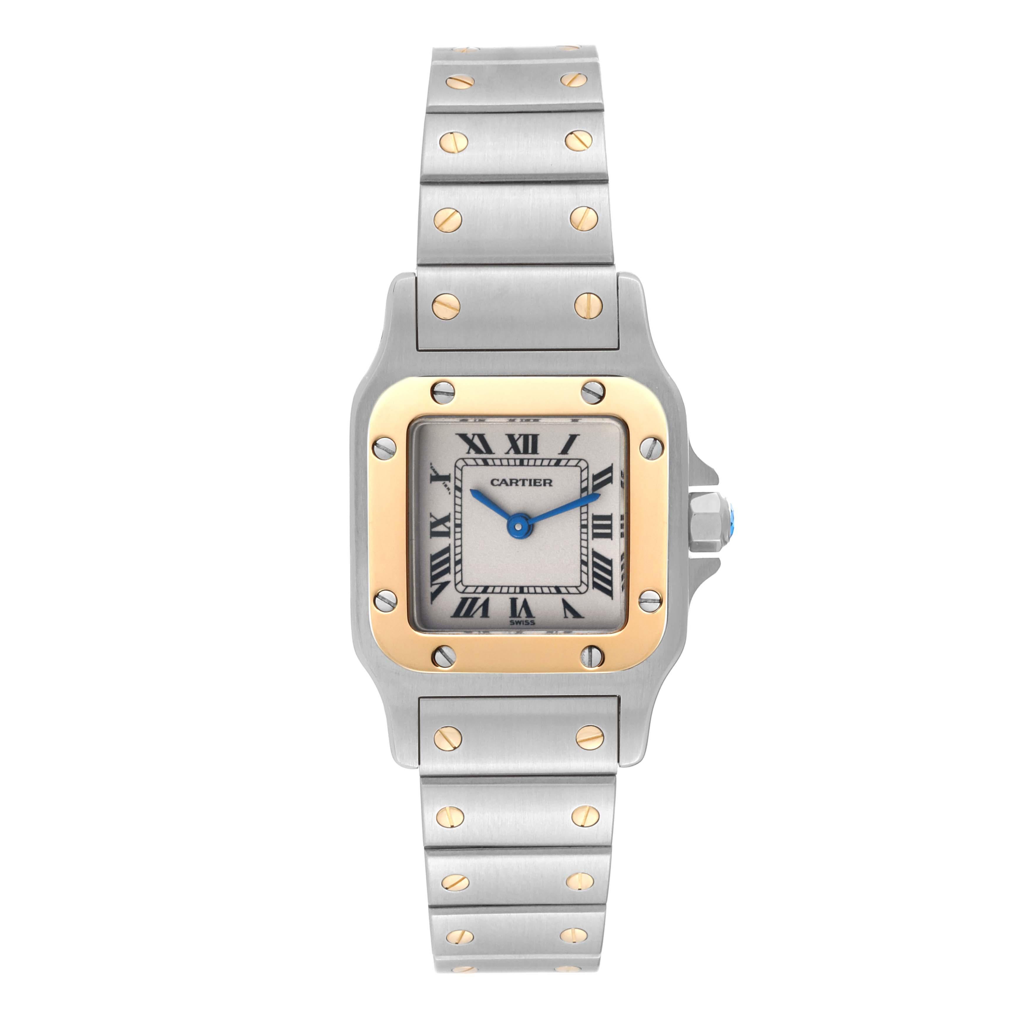 Cartier Santos Galbee Small Steel Yellow Gold Ladies Watch W20012C4. Quartz movement. Stainless steel case 24.0 x 34.7 mm. Steel octagonal crown set with a faceted blue spinel. 18K yellow gold bezel punctuated with 8 signature screws. Scratch