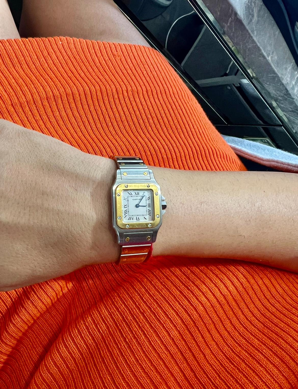 Up for sale is a classic wristwatch by Cartier. The santos Galbee is known for being a classic timepiece which exudes elegance. The watch is in perfect condition. The beautiful 18K yellow gold plays perfect contrast with the bright and shiny