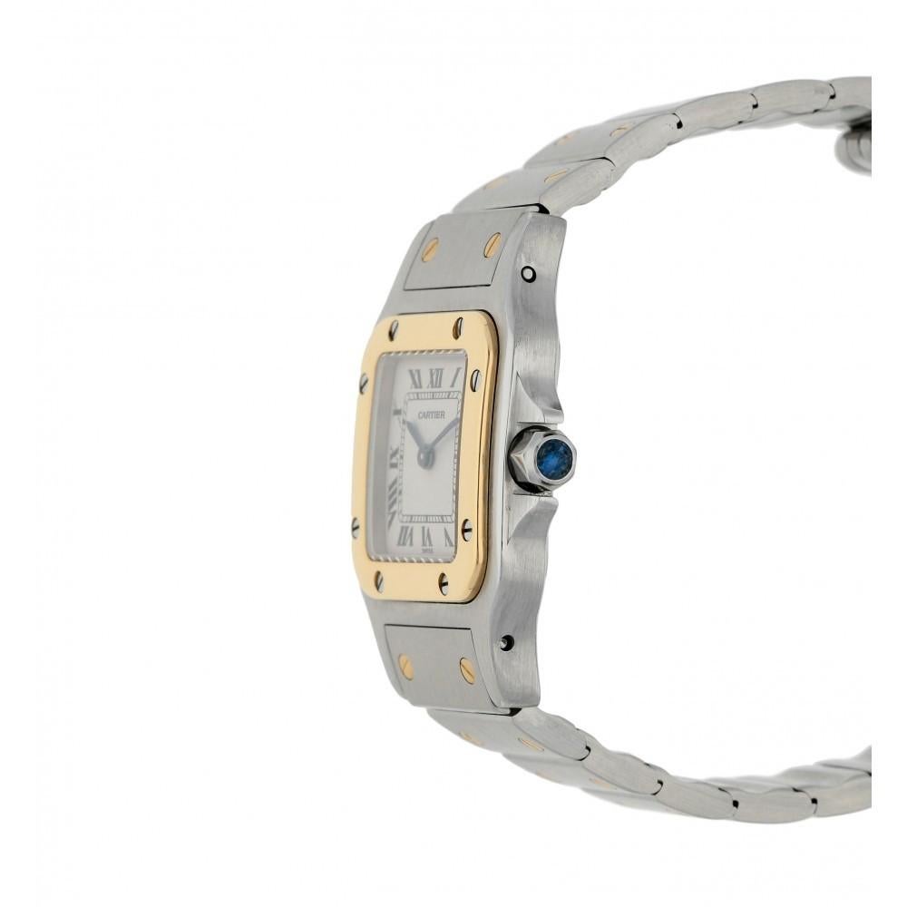 CARTIER SANTOS GALBEE TWO TONE WATCH 1567

Condition: Mint
Material: 18k Yellow Gold, Stainless Steel
Case size: 24mm
Movement: Quartz
Crystal: Scratch-resistant sapphire
Dial: White with Roman Numerals
Bezel: Fixed 18k Yellow Gold
Crown: Octagonal