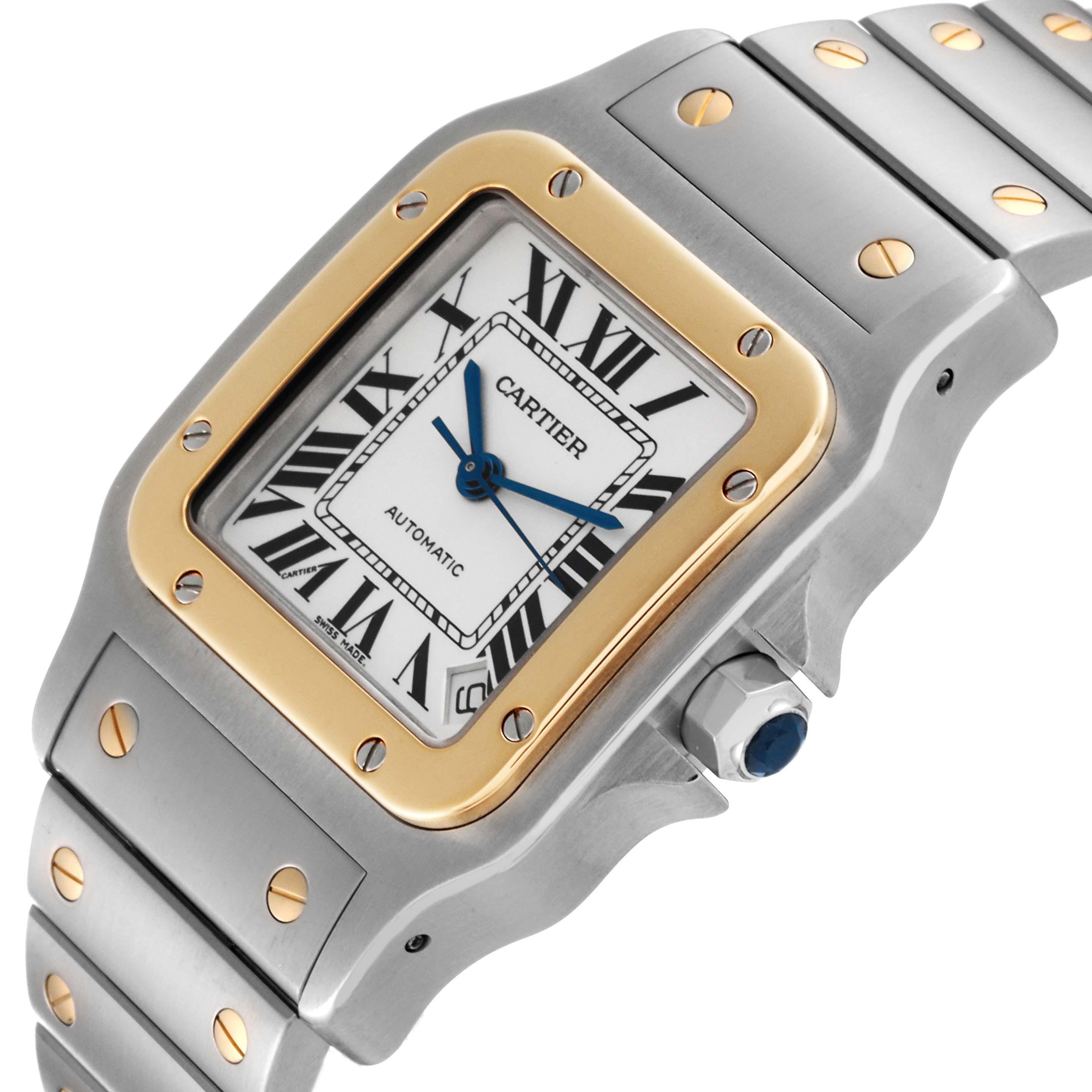 Cartier Santos Galbee XL Steel Yellow Gold Mens Watch W20099C4 Box Papers. Automatic self-winding movement, Caliber 049. Brushed and polished stainless steel case 32 X 45 mm. Stainless steel protected octagonal crown set with a faceted blue spinel