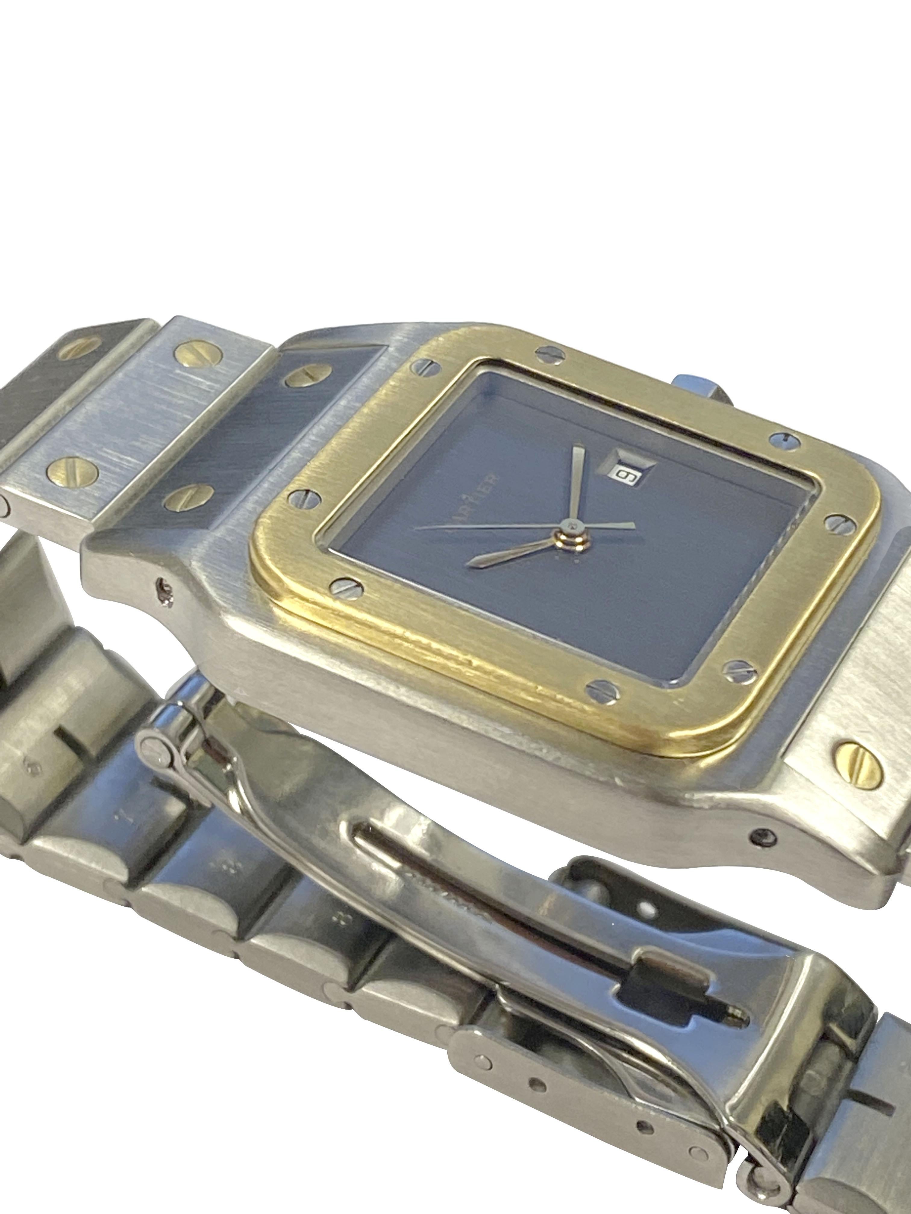 Circa 2000 Cartier Santos Wrist Watch, 40 M.M. lug to Lug X 29 M.M. 2 piece Stainless Steel case with 18K Yellow Gold bezel, Sapphire set Crown.  Automatic, self winding movement, Hard to Find Gray Satin Dial with Calendar window at the 3 and a