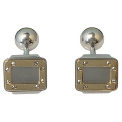 Boutons de manchette Cartier Santos en or et acier Steele