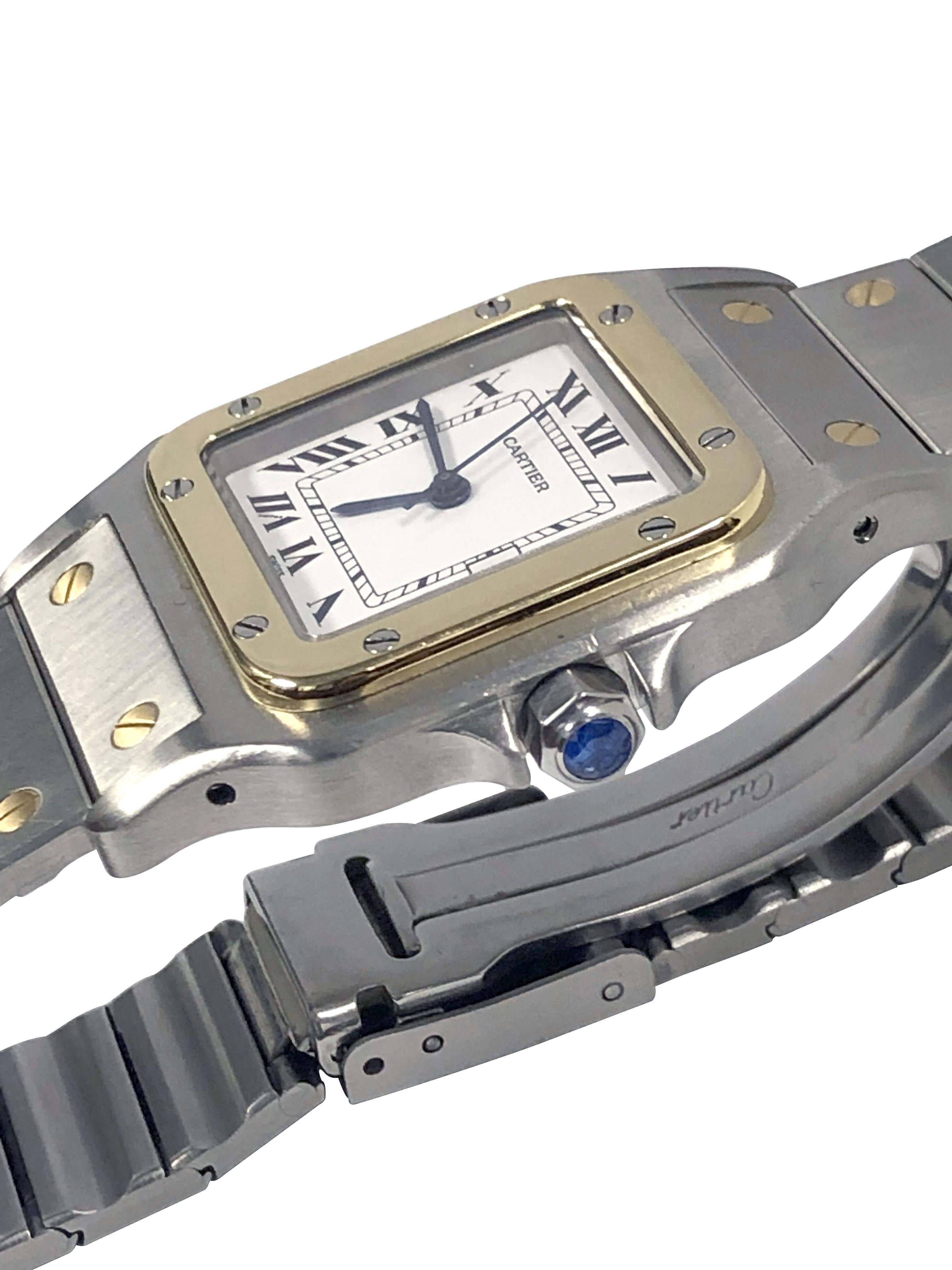 Circa 2000 Reloj de pulsera Cartier Santos Caja de acero inoxidable de 41 M.M. (de punta a punta) x 29 M.M. con bisel de oro amarillo de 18 quilates y corona de zafiro, movimiento automático de cuerda automática, esfera blanca con números romanos