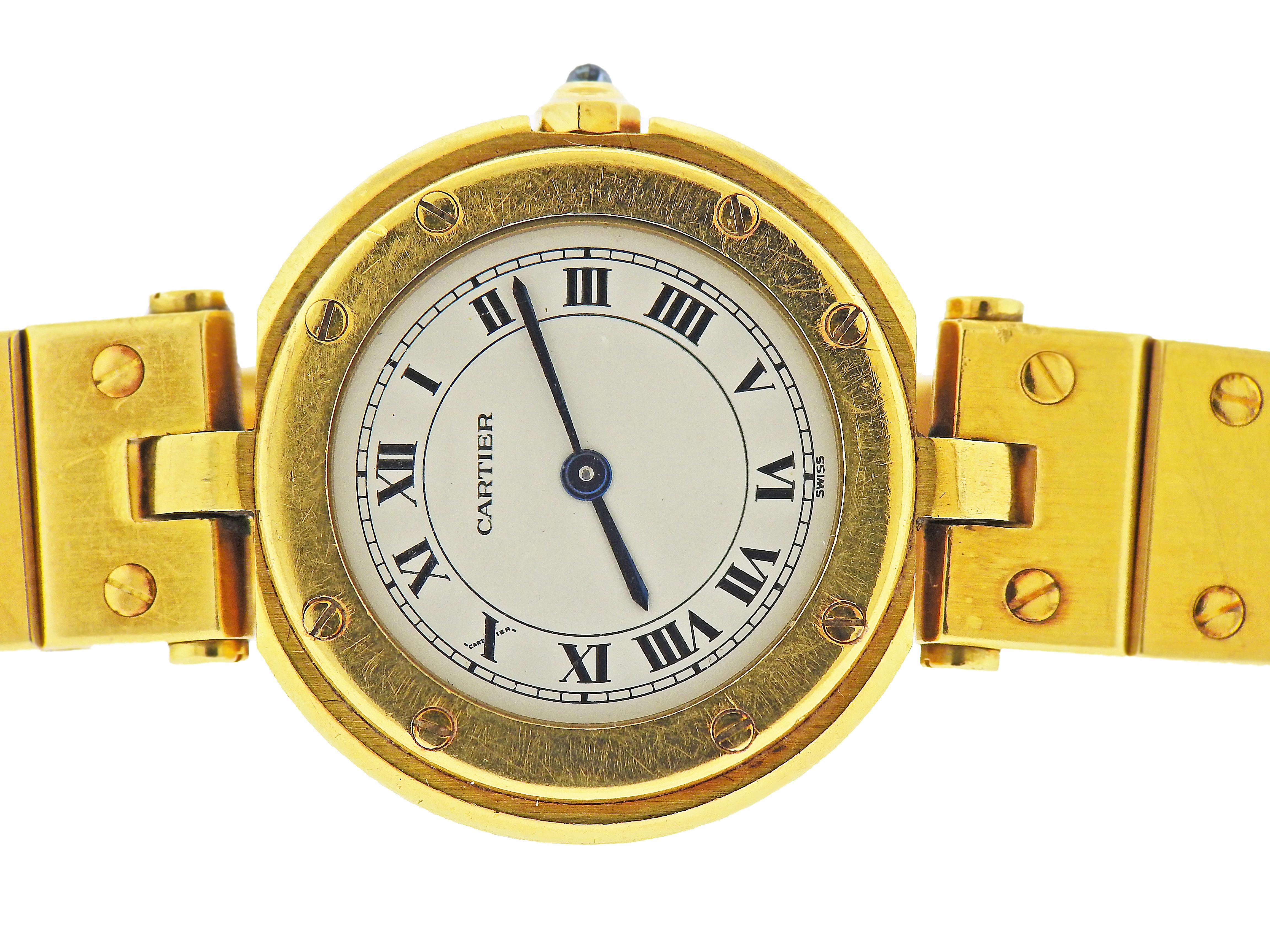 Cartier Santos 18k Yellow Gold Wristwatch

18 karat yellow gold Santos de Cartier watch, with quartz movement; case is 27 mm in diameter, full size band with gold deployment buckle; inner circumference 7.25 inches

Marked: Cartier, Quartz,