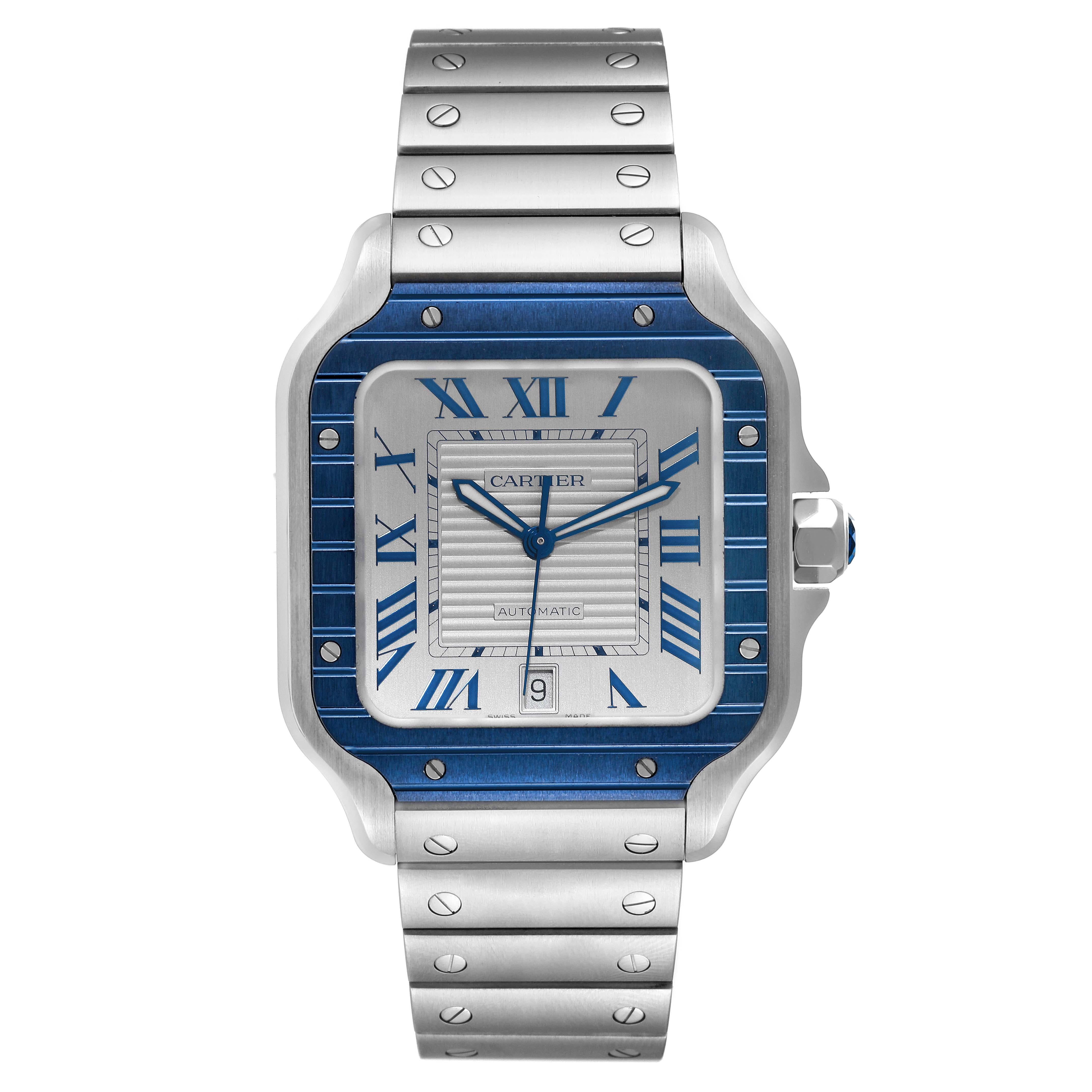 Cartier Santos Large Stainless Steel PVD Silver Dial Mens Watch WSSA0047 Unworn. Automatic self-winding movement. Stainless steel case 39.8 x 47.5 mm. Octagonal crown set with a faceted blue spinel. Blue PVD bezel punctuated with 8 signature screws.