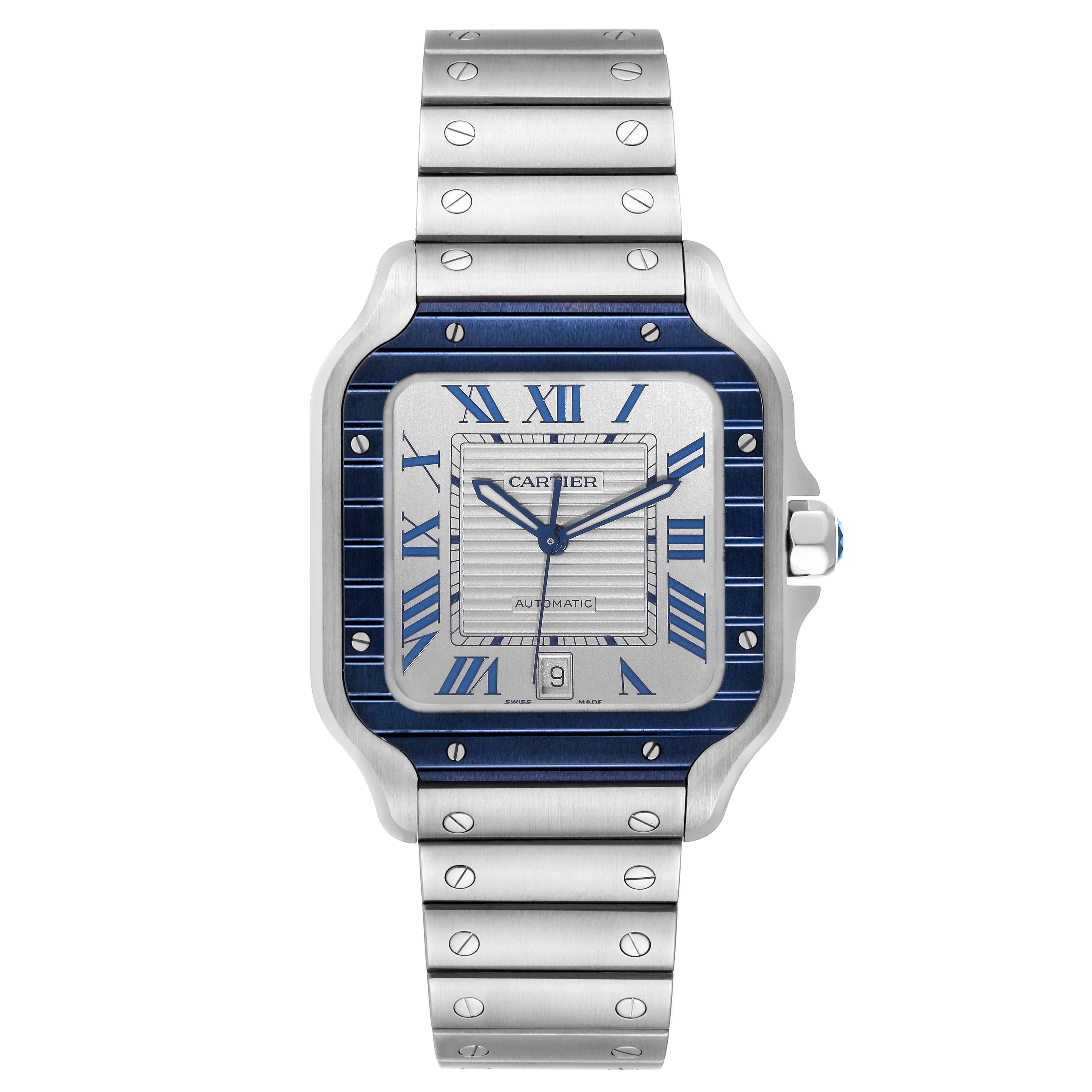 Cartier Santos Large Stainless Steel PVD Silver Dial Mens Watch WSSA0047 Unworn. Automatic self-winding movement. Stainless steel case 39.8 x 47.5 mm. Octagonal crown set with a faceted blue spinel. Blue PVD bezel punctuated with 8 signature screws.