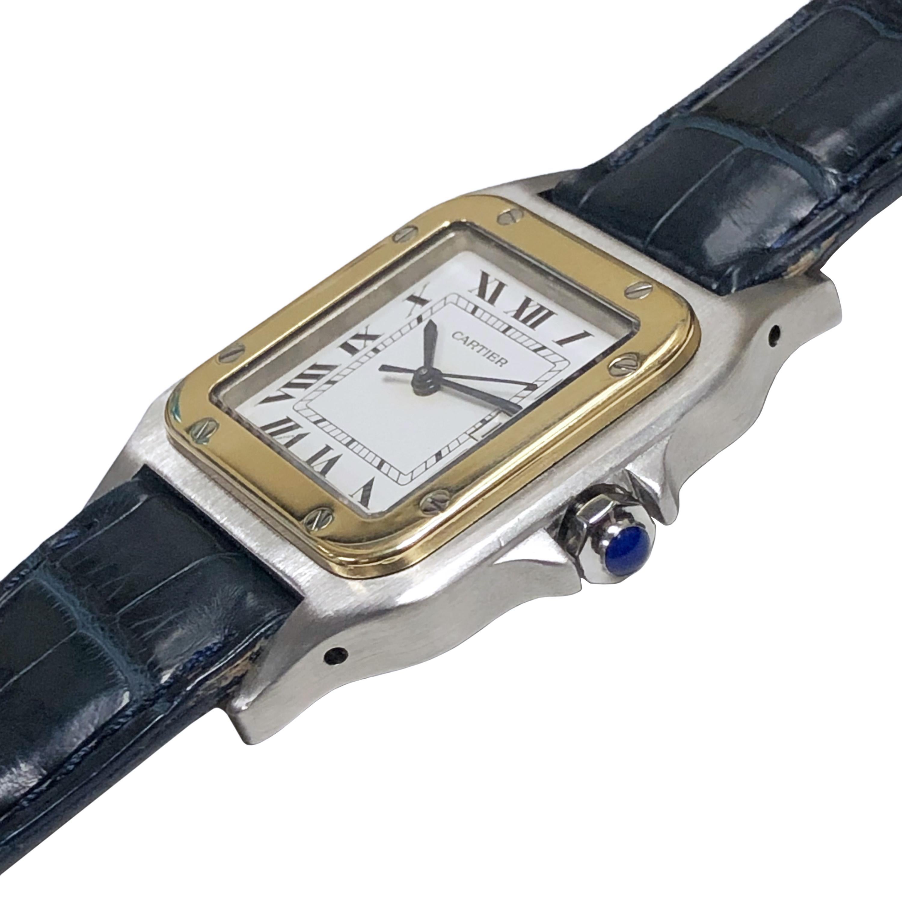 Circa 2005 Cartier Santos Wrist Watch, 41 M.M. ( lug end to end ) X 29 M.M. Stainless Steel 2 piece Water resistant case with 18k Yellow Gold Bezel. Automatic, self winding movement, Sapphire Crown, White dial with Black Roman numerals, sweep
