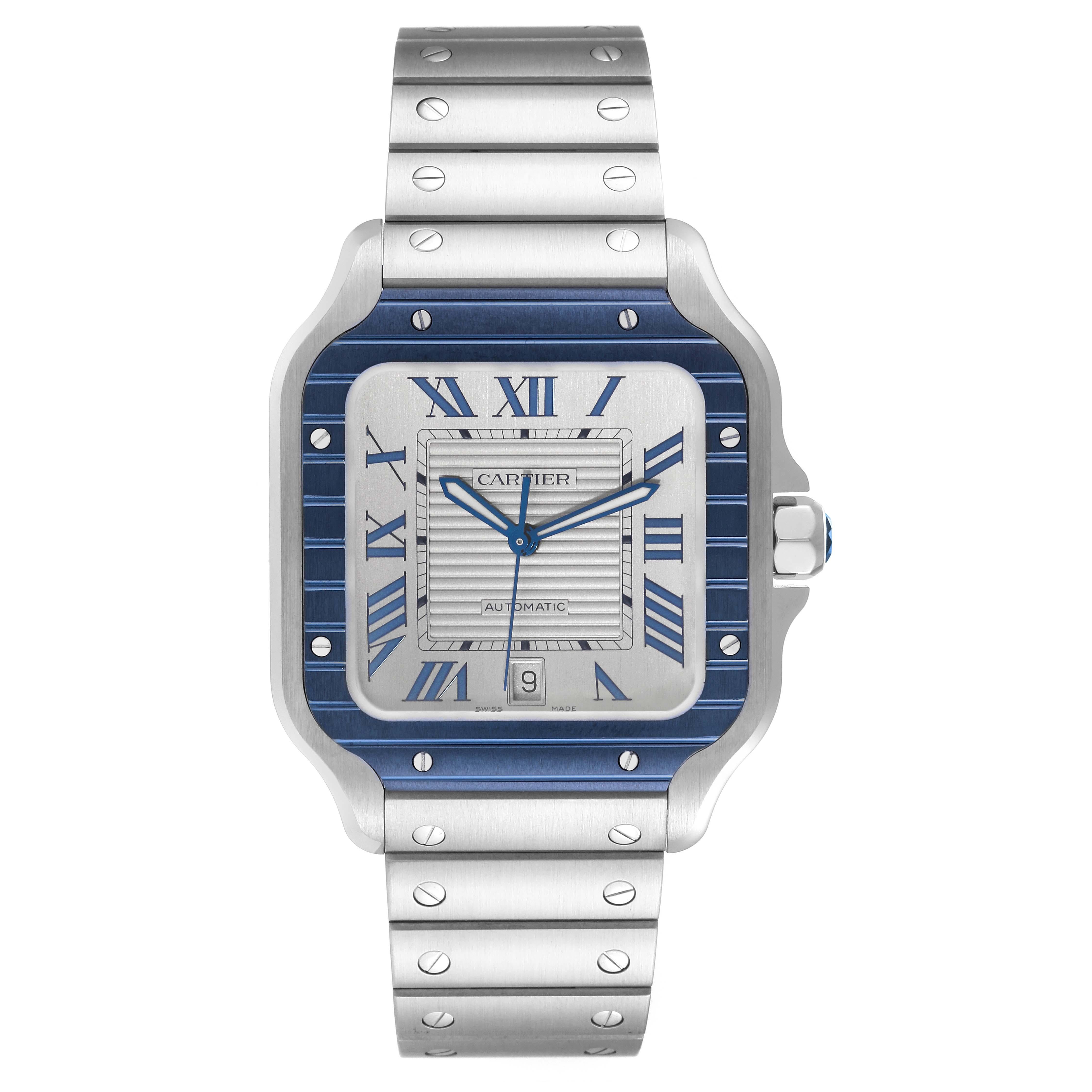 Cartier Santos Large Steel PVD Bezel Silver Dial Mens Watch WSSA0047 Unworn. Automatic self-winding movement. Stainless steel case 39.8 x 47.5 mm. Octagonal crown set with a faceted blue spinel. Blue PVD bezel punctuated with 8 signature screws.