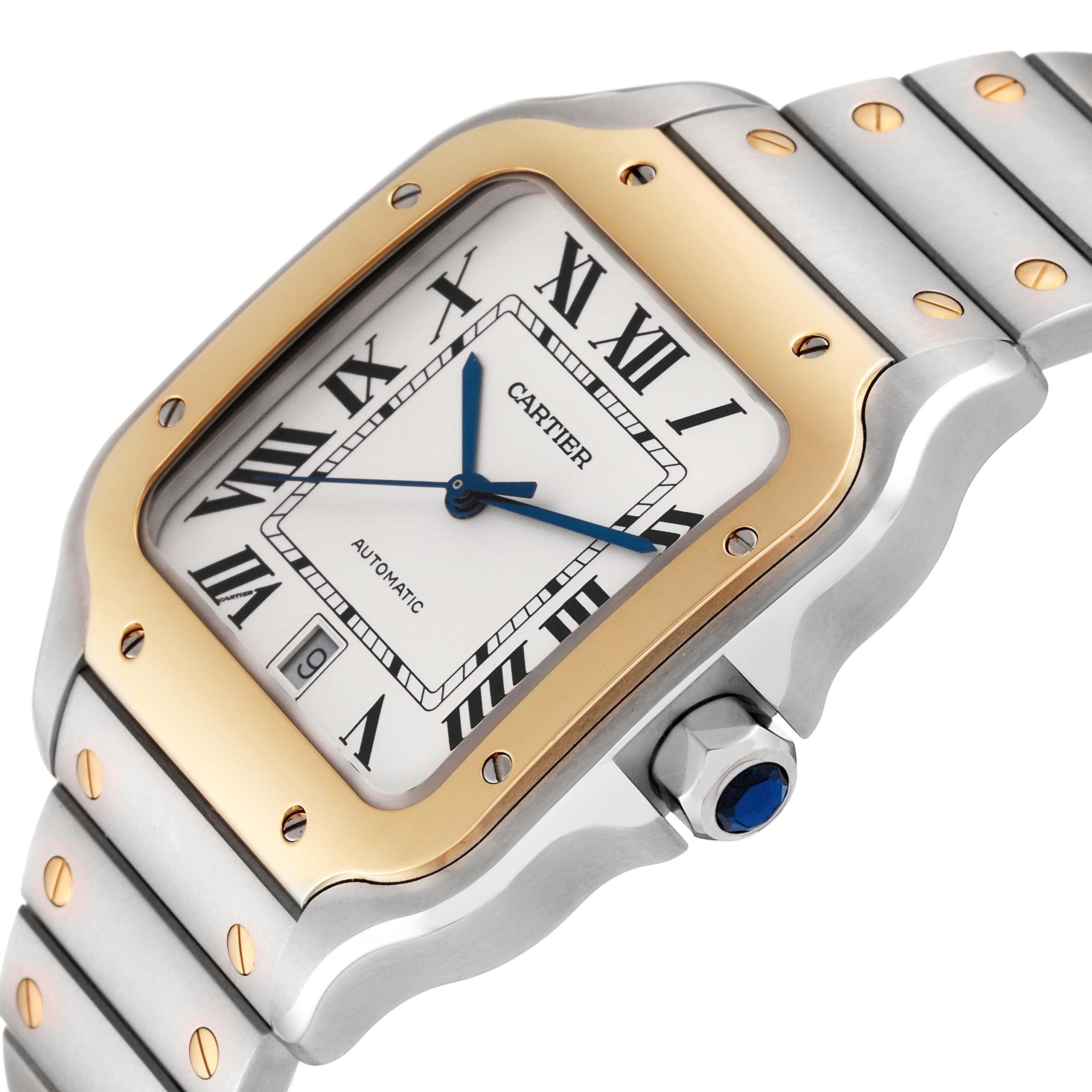 Cartier Santos Large Steel Yellow Gold Mens Watch W2SA0009 Unworn. Automatic self-winding movement. Stainless steel case 39.8 x 47.5mm. Steel octagonal crown set with blue faceted spinel. 18k yellow gold bezel punctuated with 8 signature screws.