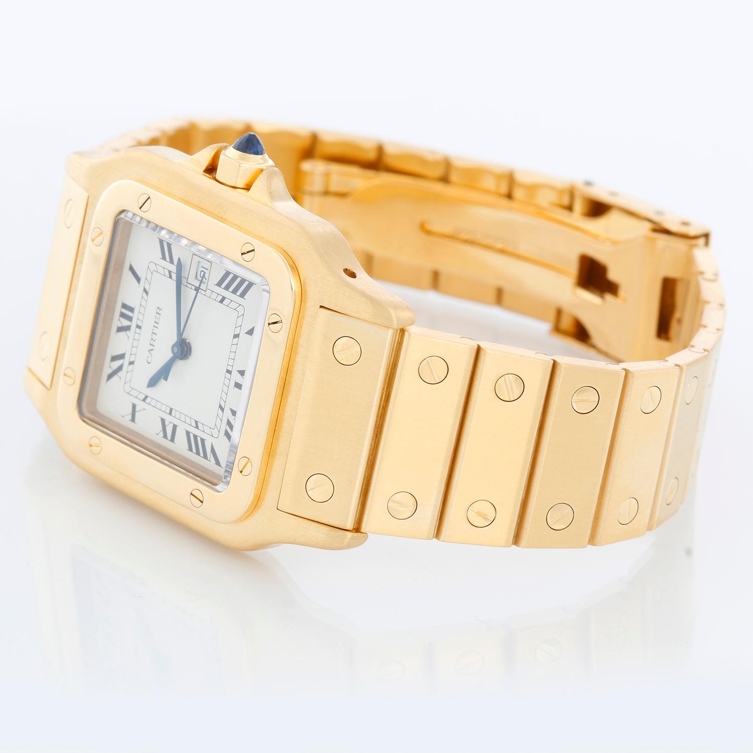 Cartier Santos Men's 18k Yellow Gold Watch W20010C5 - Automatic. 18k yellow gold case (29mm x 41mm). White dial with black Roman numerals and date at 3 o'clock. 18K Yellow Gold Santos bracelet;  will fit up to a 7 inch wrist . Pre-owned with Cartier
