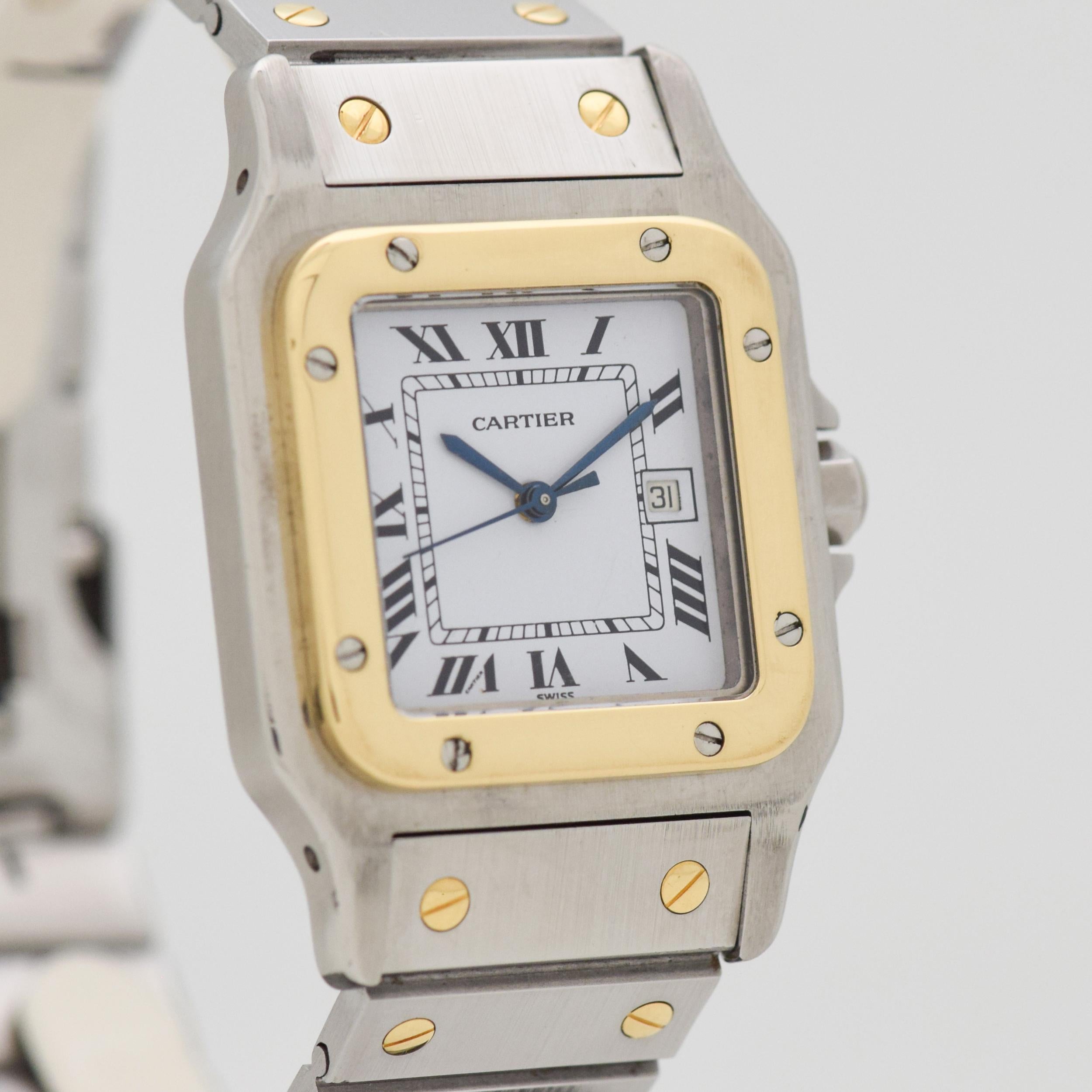 1990's Cartier Santos Automatic Men's Standard Size Two Tone 18k Yellow Gold and Stainless Steel watch with Original White Dial with Roman Numerals with Original Cartier Two Tone 18k Yellow Gold and Stainless Steel Bracelet. Suitable for a Man or a
