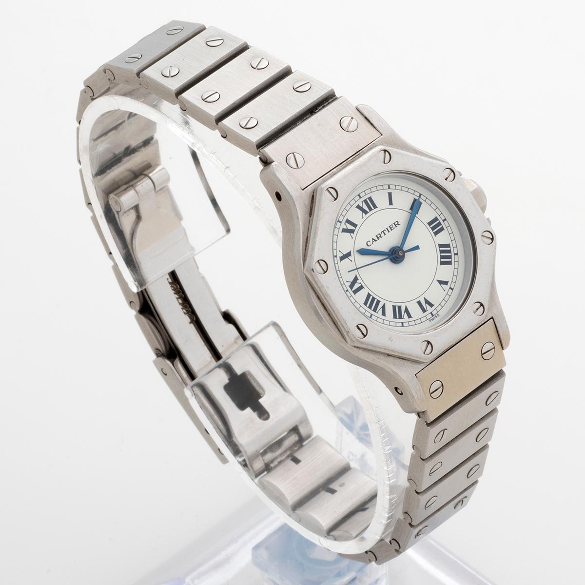 Our vintage Cartier Santos Octagane with automatic movement , reference 0906 , features a 24mm stainless steel case, white Roman Numeral dial and stainless steel bracelet. Presented in excellent unpolished condition, there are light signs of use