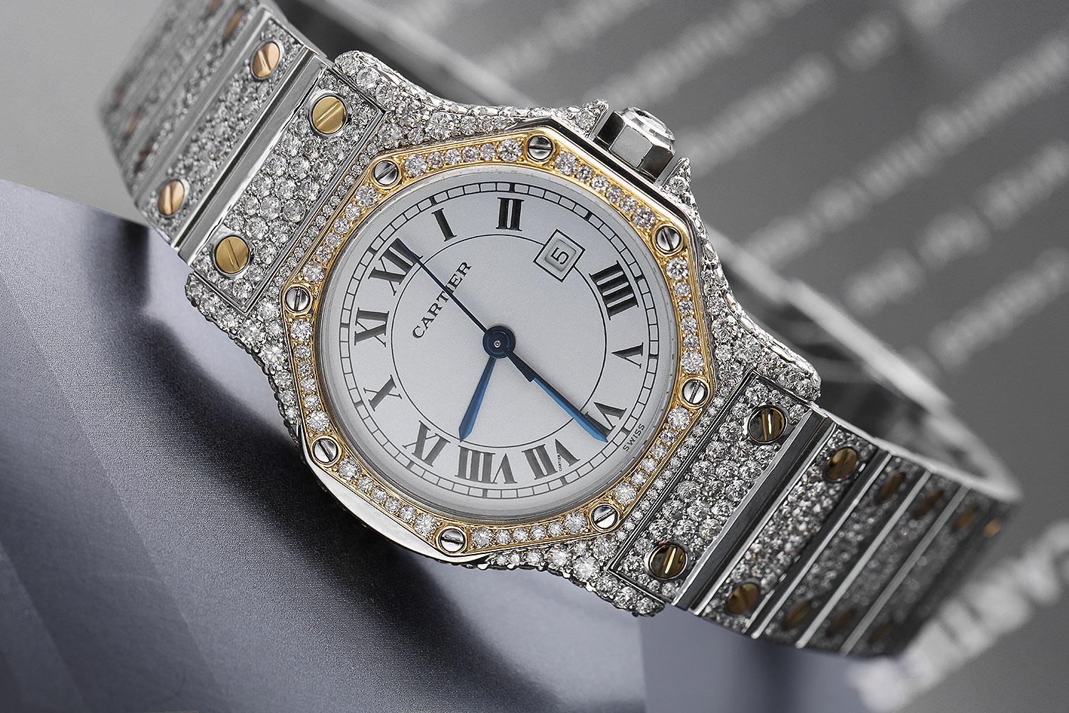 Cartier Santos Octagon 18K Gold and Steel Automatic Ladies Diamond Watch 2966.

This watch has been customized very recently. It has never been worn after diamonds were set and it does not have any visible scratches or blemishes. It is covered by
