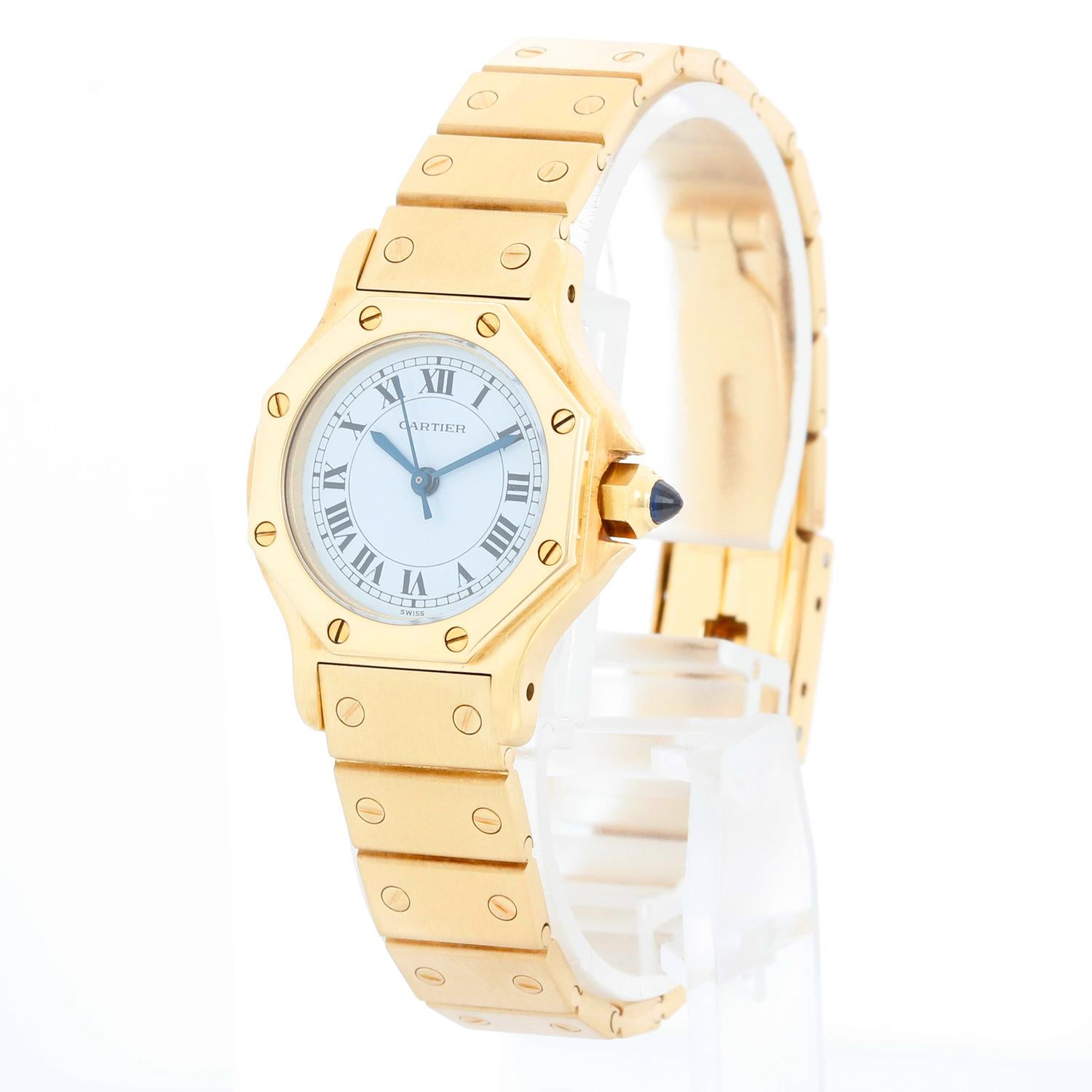 Cartier Santos Octagon 18k Yellow Gold Automatic Watch 0906 - Automatic winding. Yellow Gold case (26mm x 31mm). White dial with roman numerals. Yellow Gold Santos bracelet; will fit a 6-1/2 inch wrist. Pre-owned with Cartier box, book and papers.