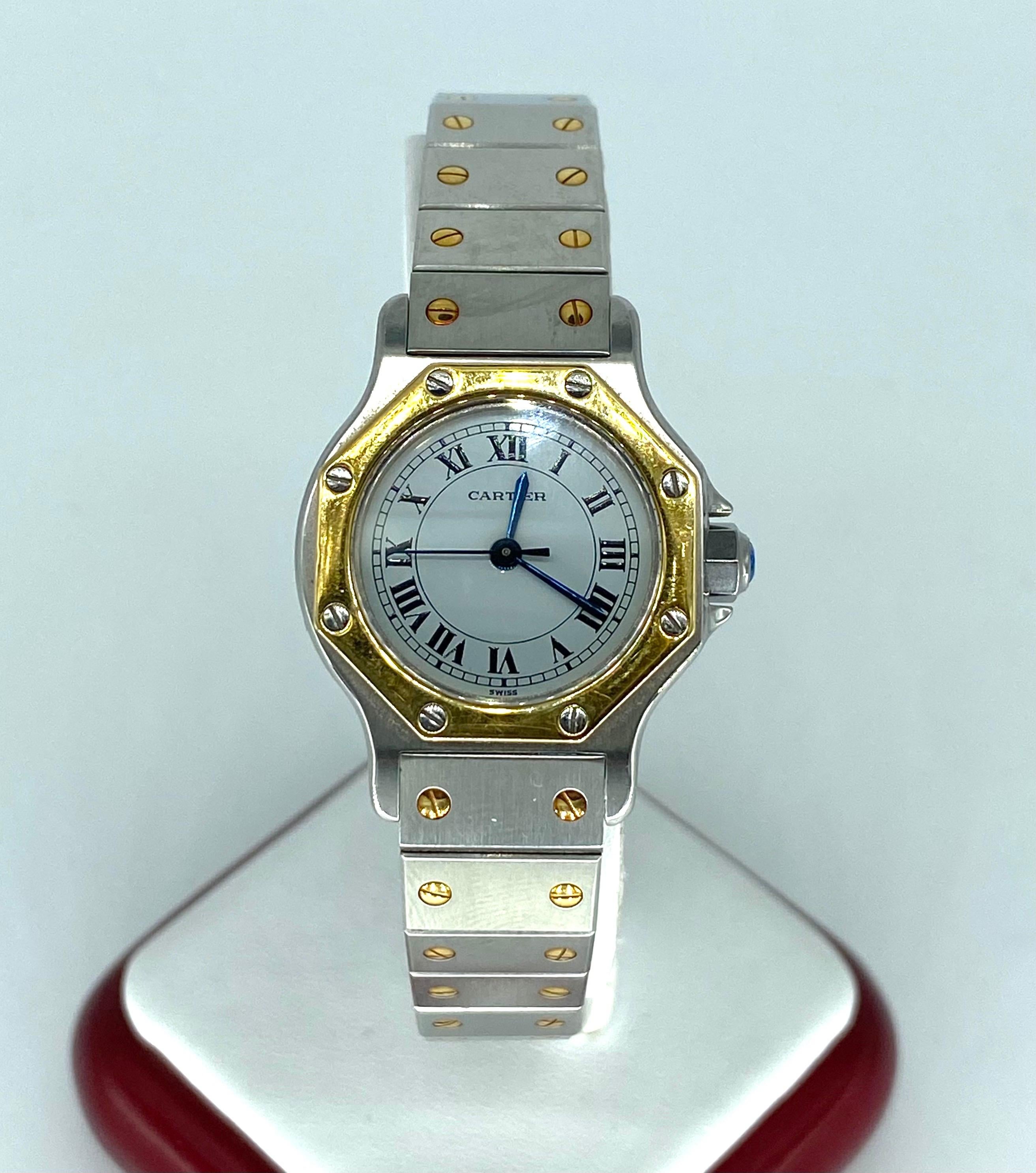 Silver-tone stainless steel case with a two-tone (silver-tone and yellow gold-tone) 18kt yellow gold and stainless steel bracelet. Fixed yellow gold-tone 18kt yellow gold bezel. White dial with blued-steel sword-shaped hands and Roman numeral hour