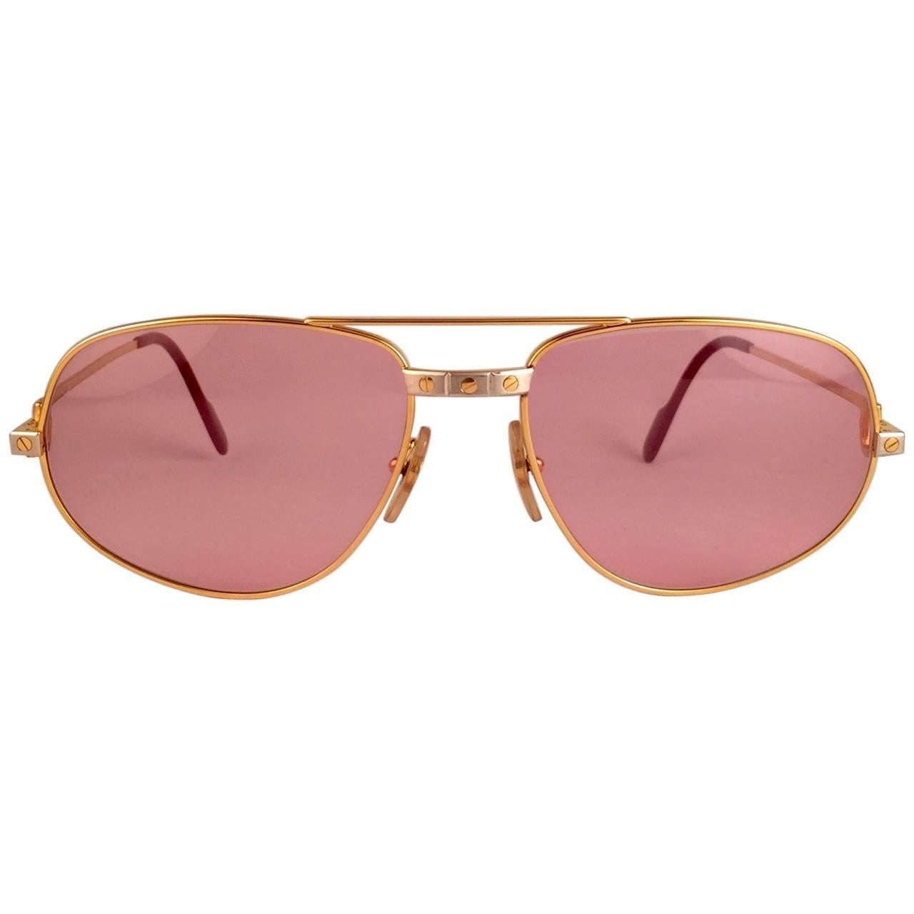 Mint Cartier Santos Romance sunglasses with !!! new !!! rose pink  (uv protection). not a spot on them, perfect! All hallmarks. 
Red enamel with Cartier gold signs on the earpaddles. Both arms sport the C from Cartier on the temple. 
These are like
