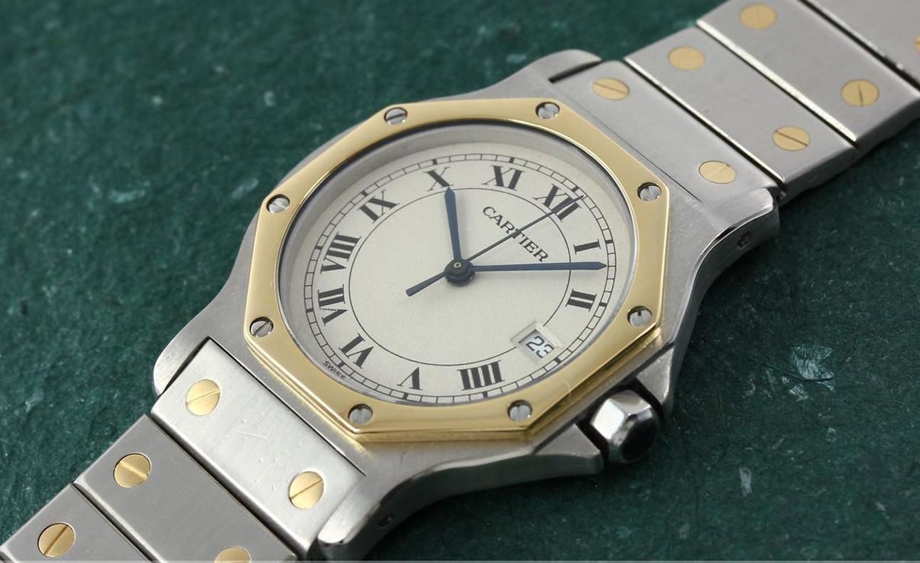 Santos Ronde Automatic. Made in the 1990s. Fine, octagonal, center seconds, self-winding, stainless steel and 18K yellow gold wristwatch with date a stainless steel Santos link bracelet with 2 gold screws on each link and concealed deployant