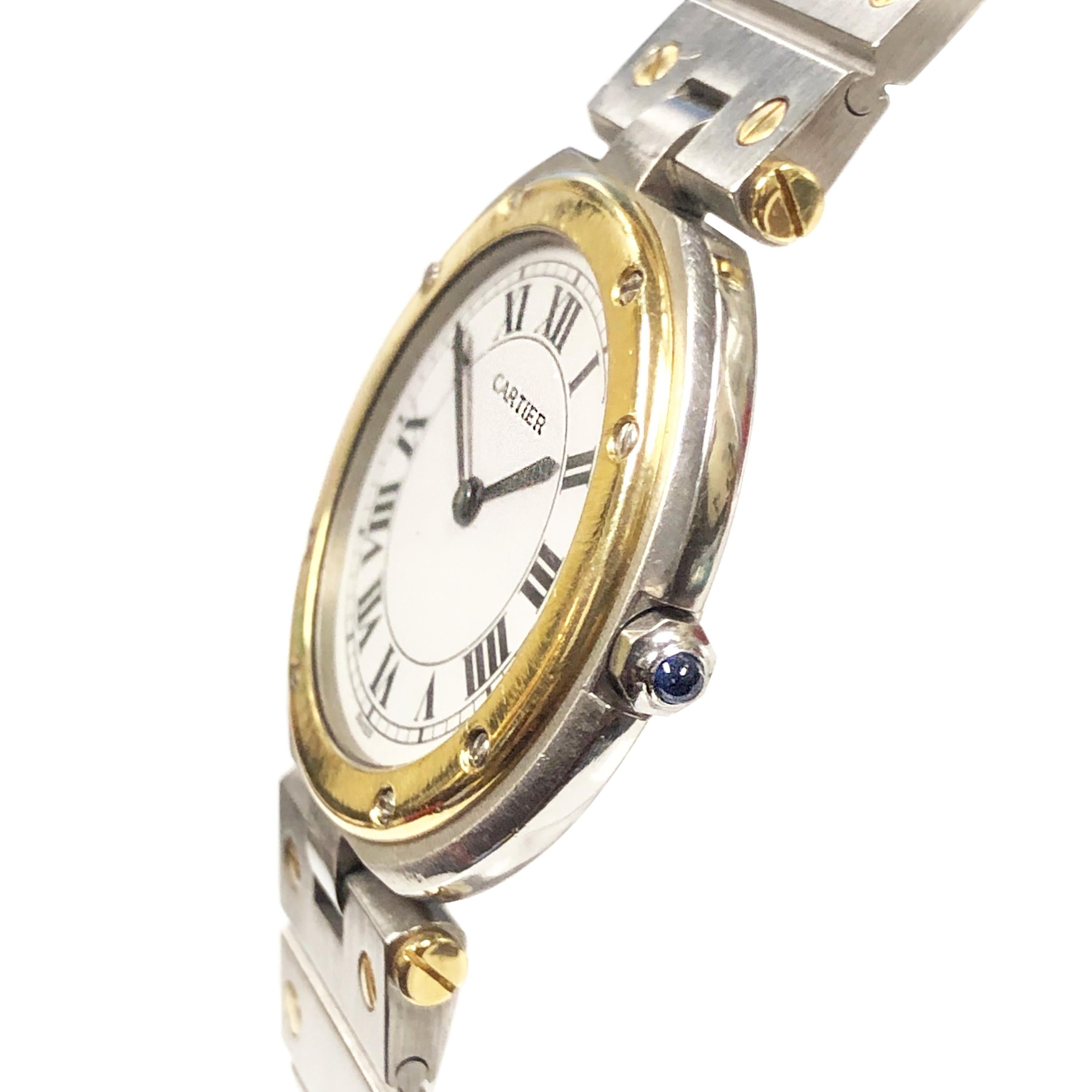 Circa 2000 Cartier Santos Ronde, 32 M.M. Stainless Steel Case with 18K yellow Gold Bezel, Quartz movement, White Dial with Black Roman Numerals, Sapphire Crown. 5/8 inch wide Stainless Steel and 18K yellow Gold Santos Bracelet with fold over